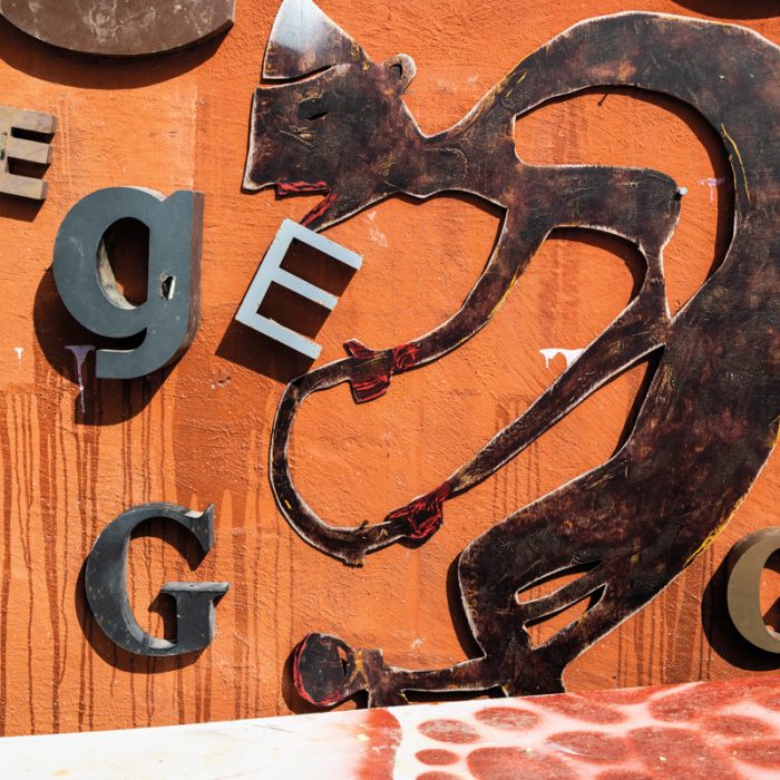 Metal scraps and found letters adorn the exterior of Nelson's studio.