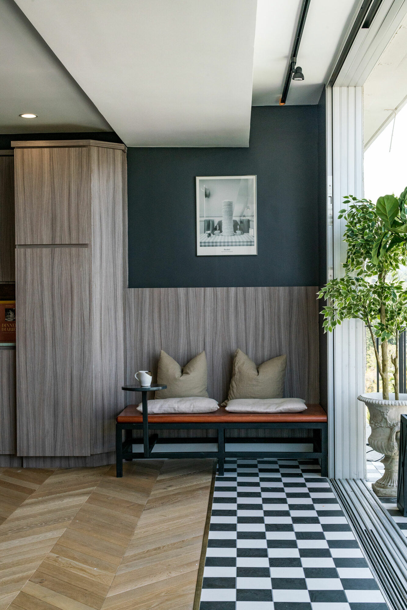 when thinking about paint colors for small spaces think about bridging rooms like this dark green kitchen nook