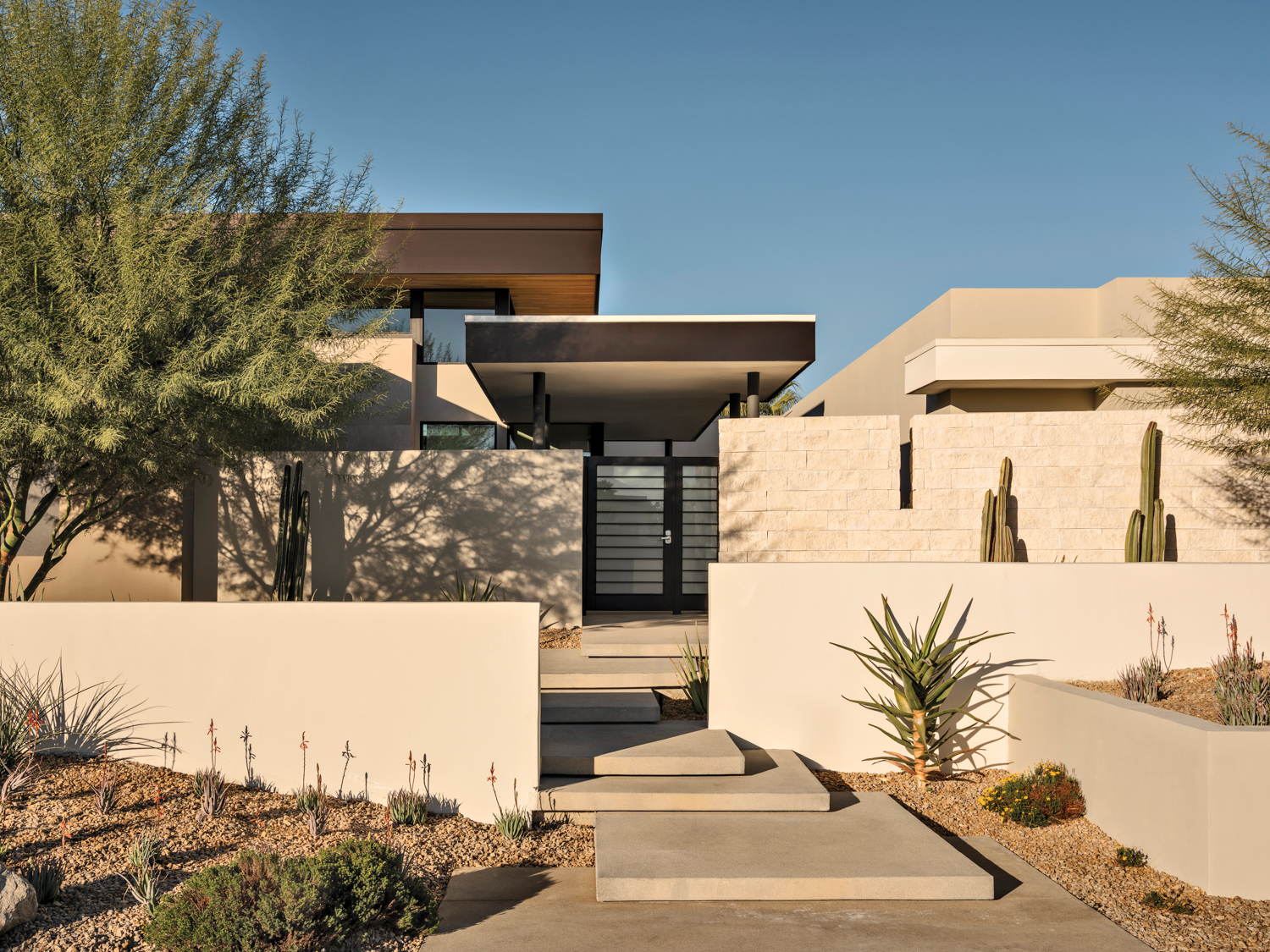 rectilinear home facade made of stone and stucco