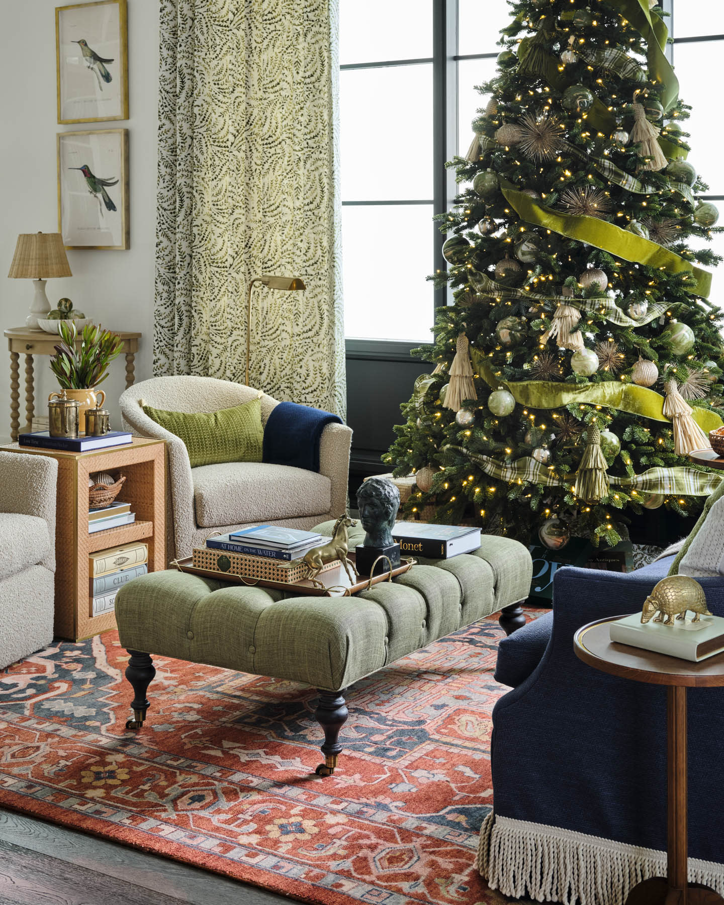 green upholstered coffee table in front of a decorated Christmas tree