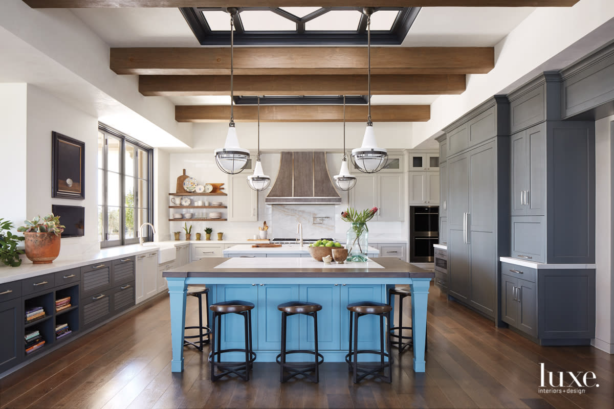 transitional kitchen gray and white cabinetry blue island