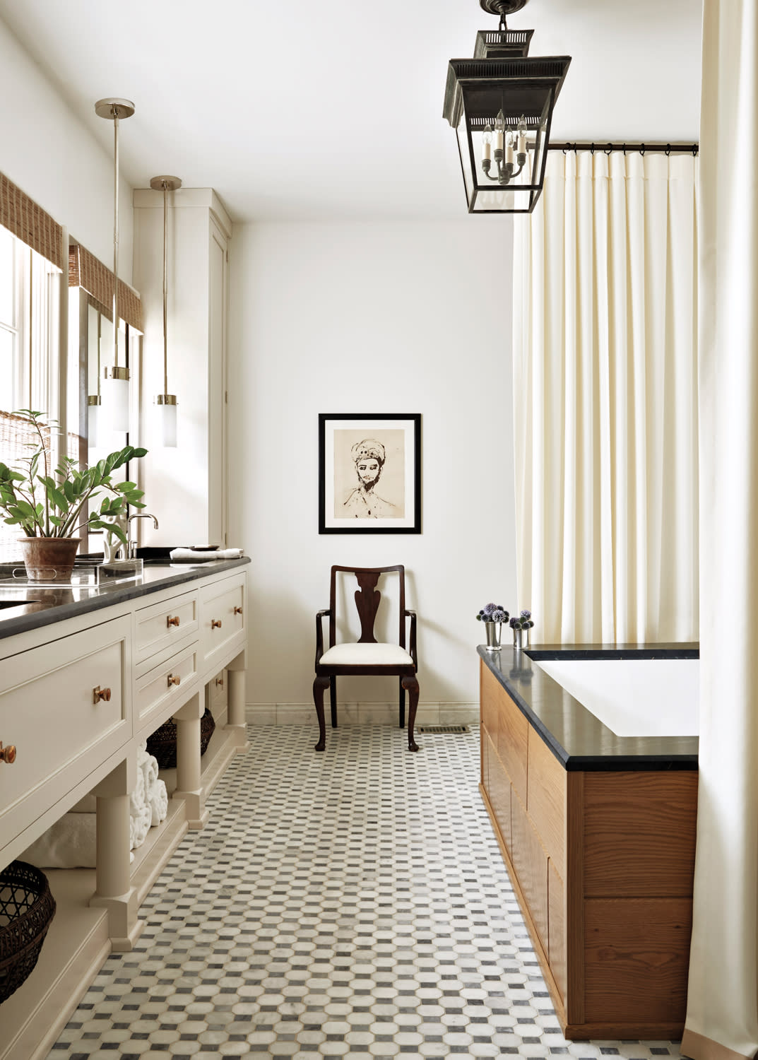 Ivory bathroom with soft curtain, large vanity sink and soaking tub