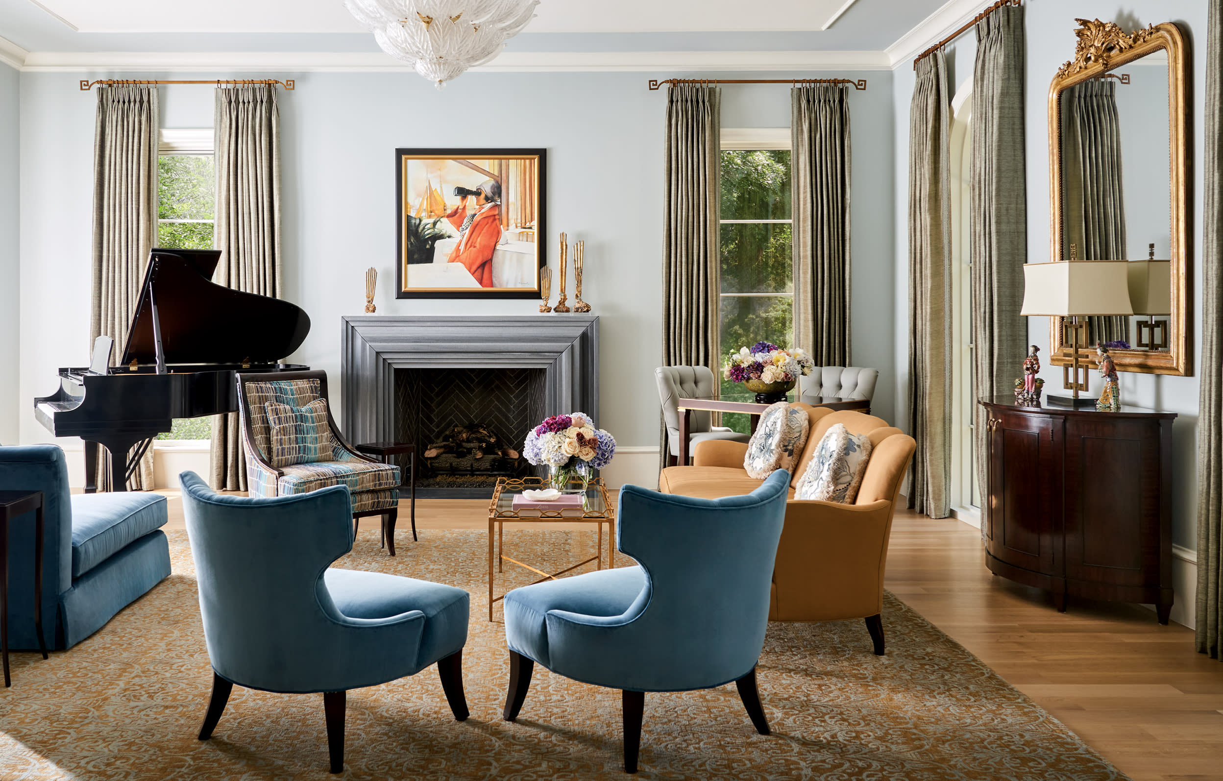 blue armchairs in a modern meets traditional living room 