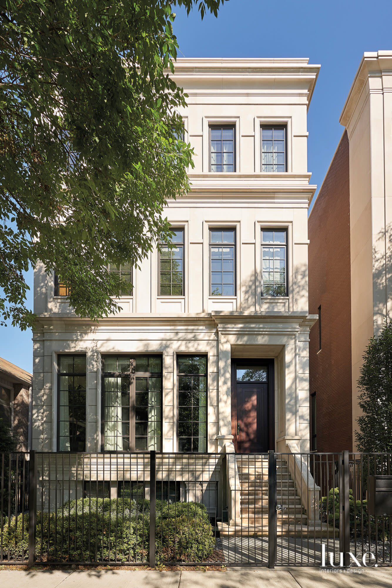 The four-story townhouse is clad in limestone.