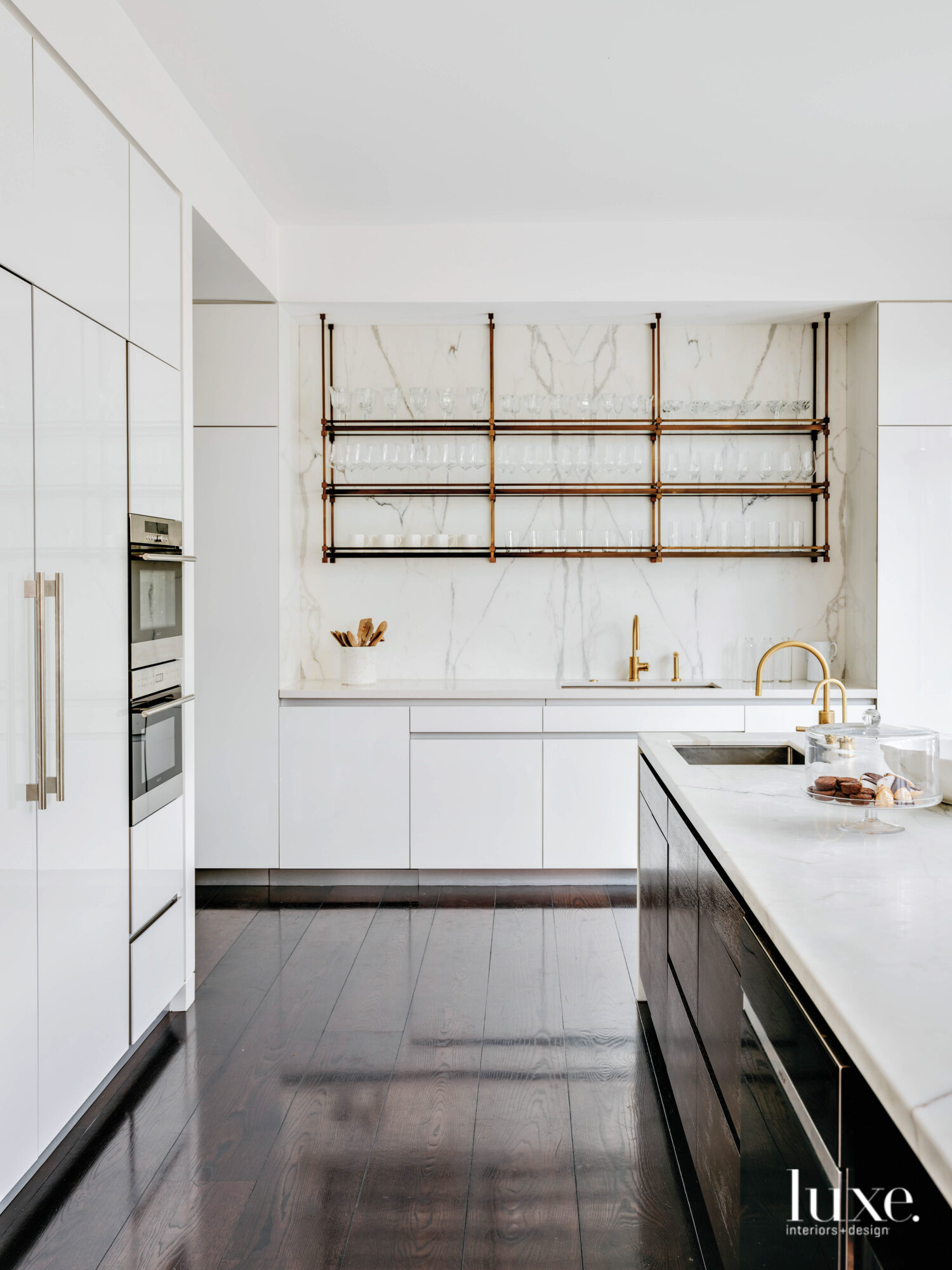 A kitchen features open shelving.