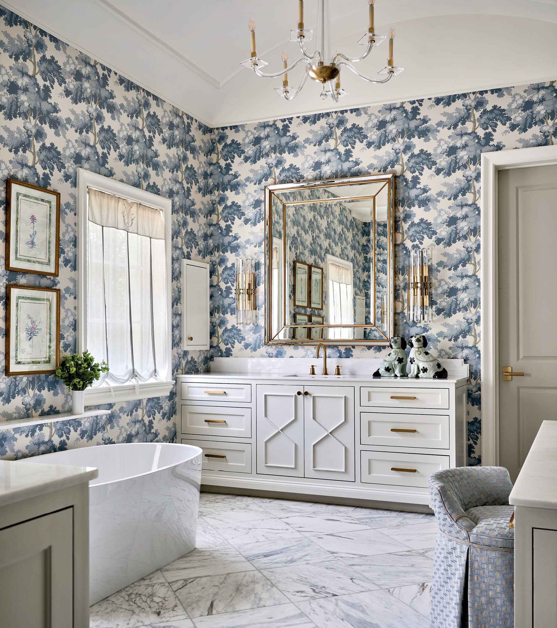 bold blue floral wallpaper lines a modern bathroom