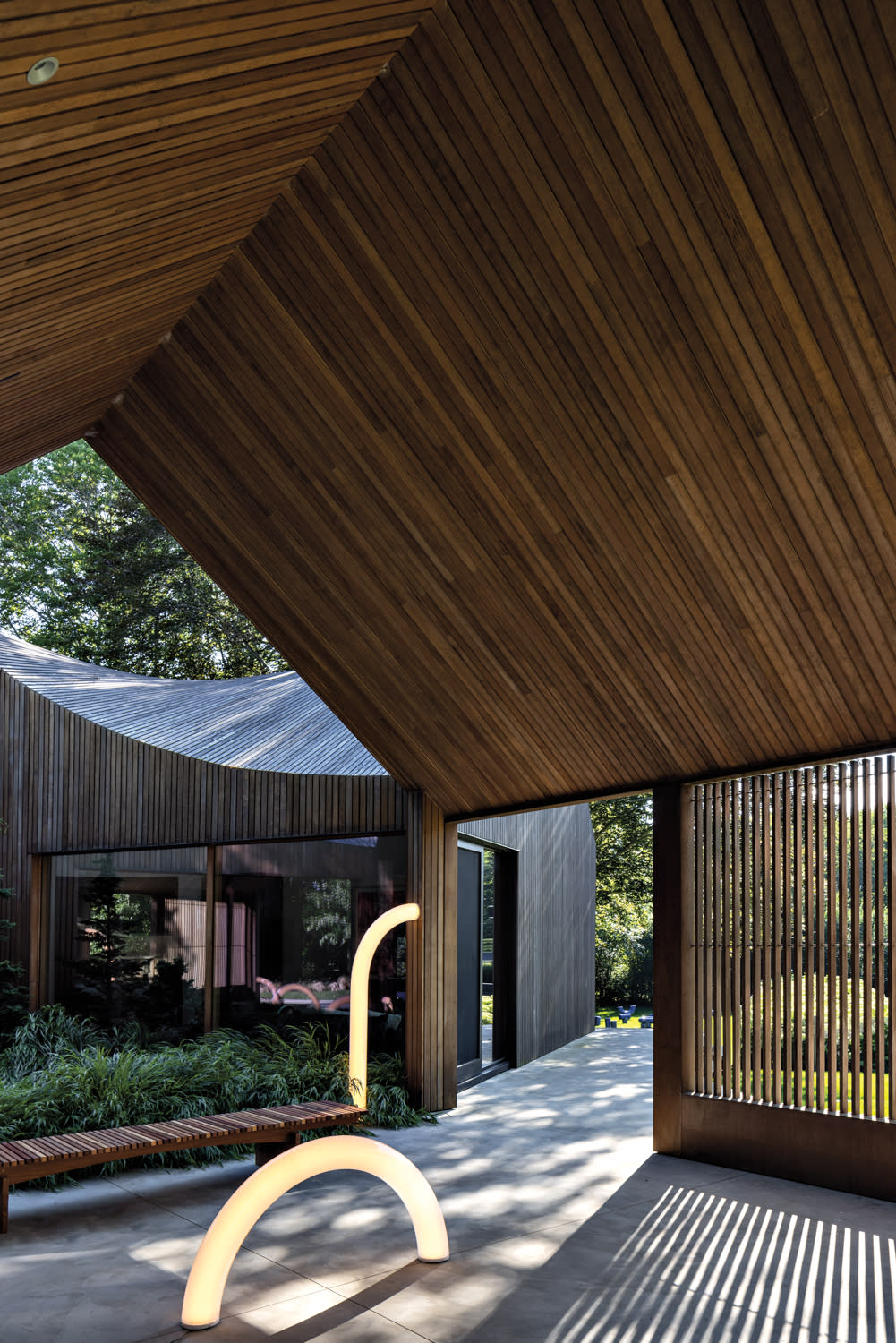 outdoor light installations underneath a tall wooden roof