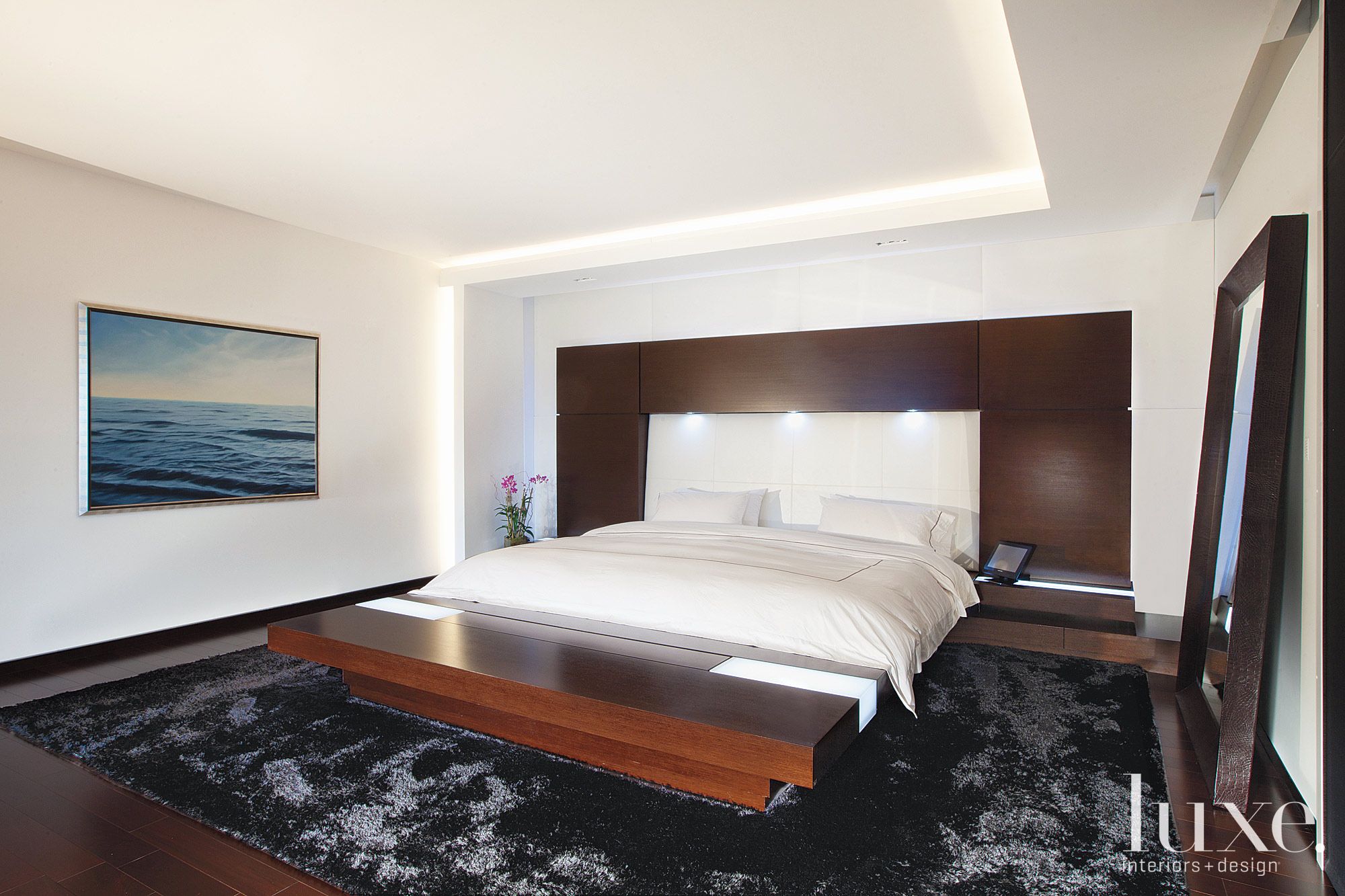 Extra large platform bed in master bedroom | LUXE Interiors + Design, image size:2000x1333