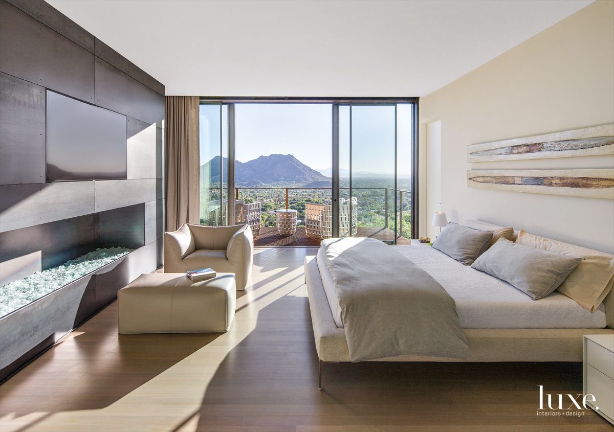 Modern Cream Master Bedroom with Custom Steel Fireplace | LUXE Interiors + Design