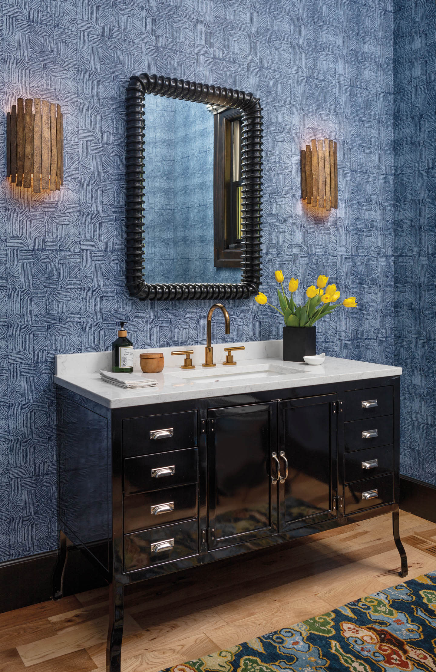 blue powder room with patterned wallcovering