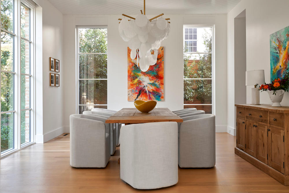 clean, contemporary dining room with neutral palate and featured artwork.