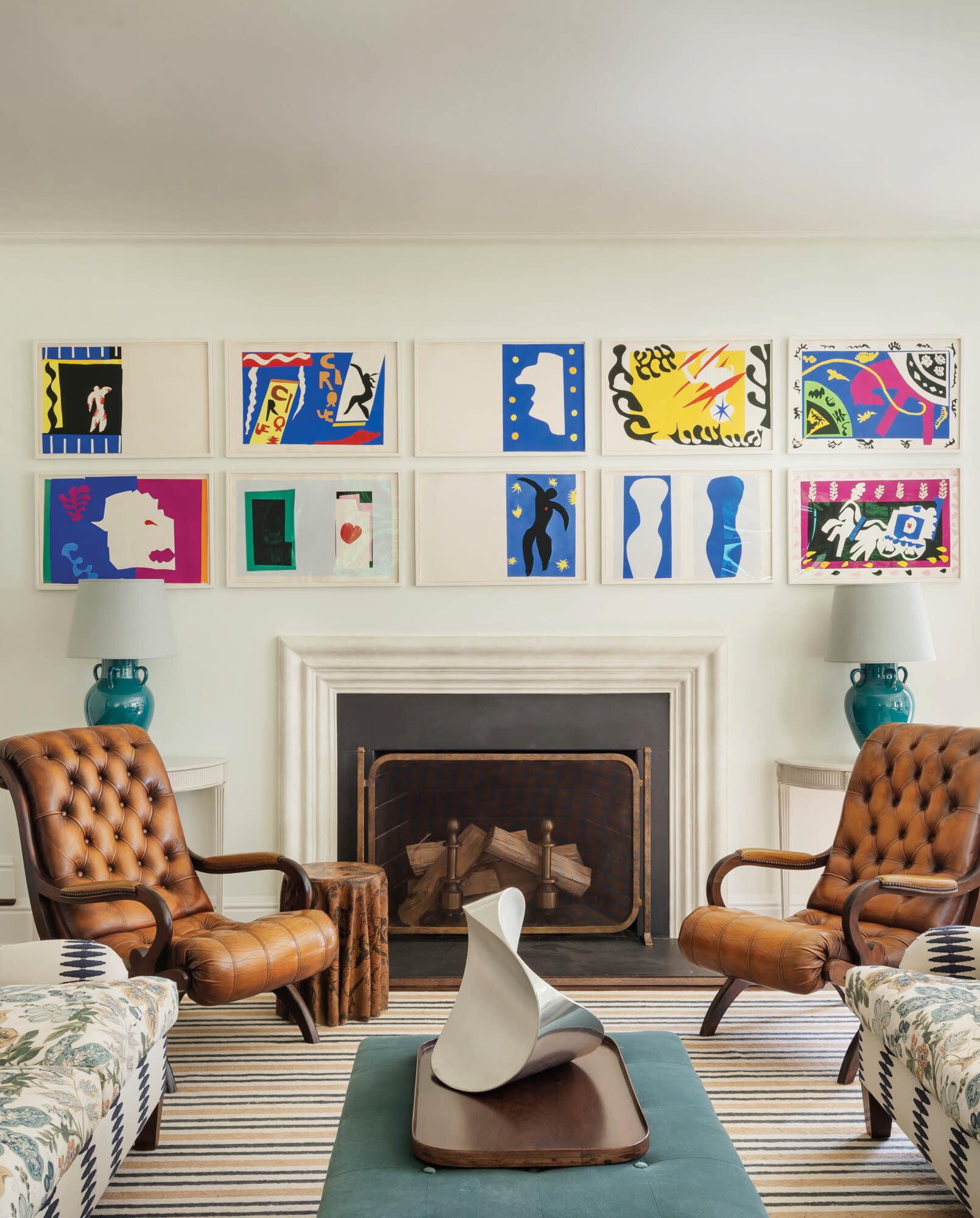 sitting area with leather armchairs and artwork