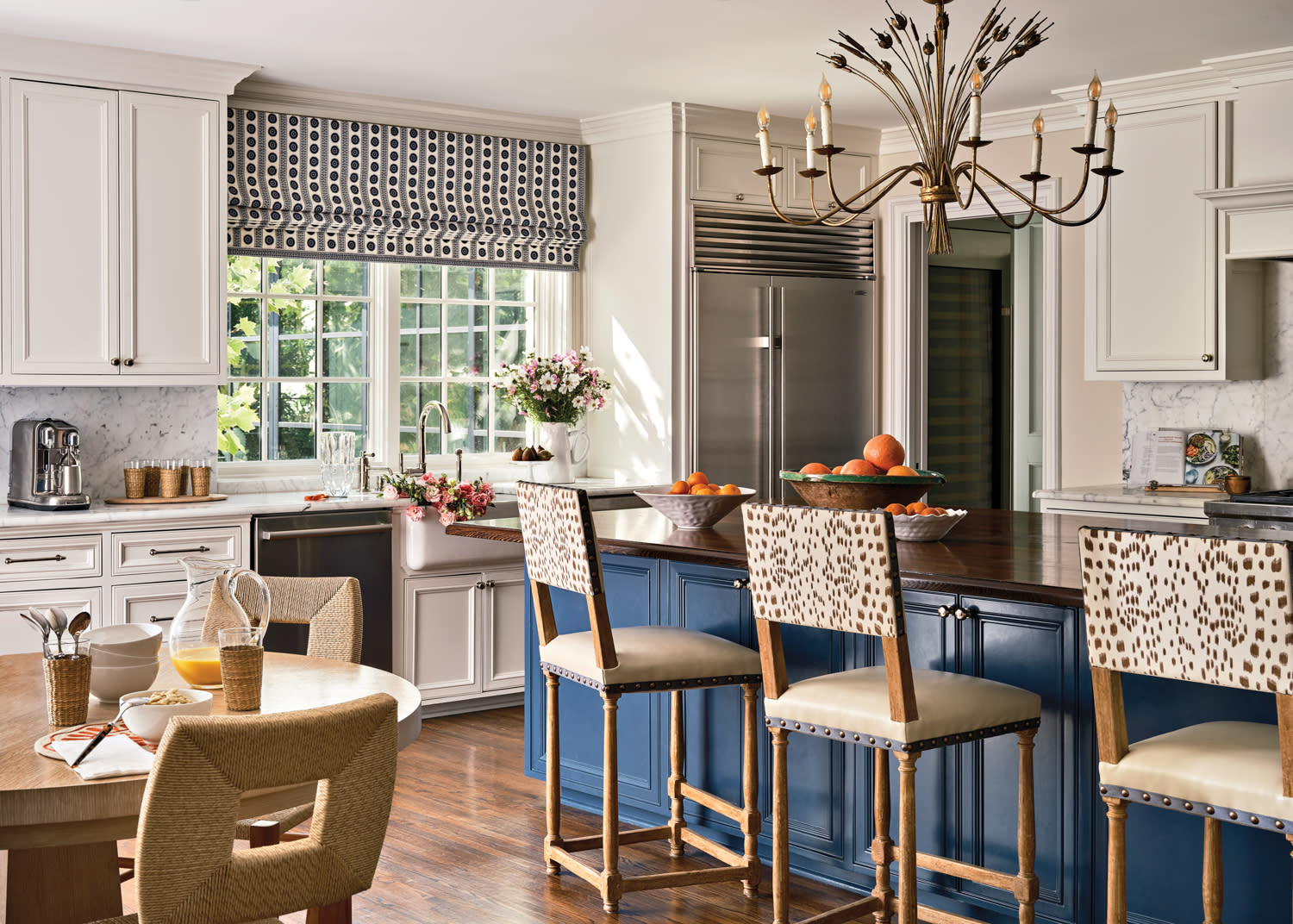 white kitchen with a dark blue island