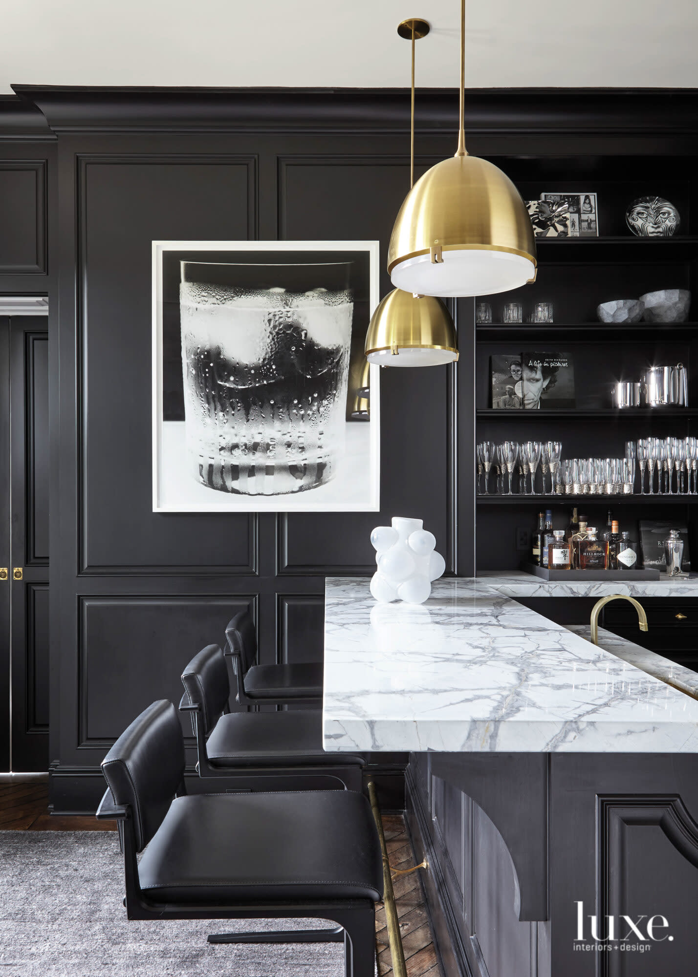 moody black bar with marble and brushed bronze pendants