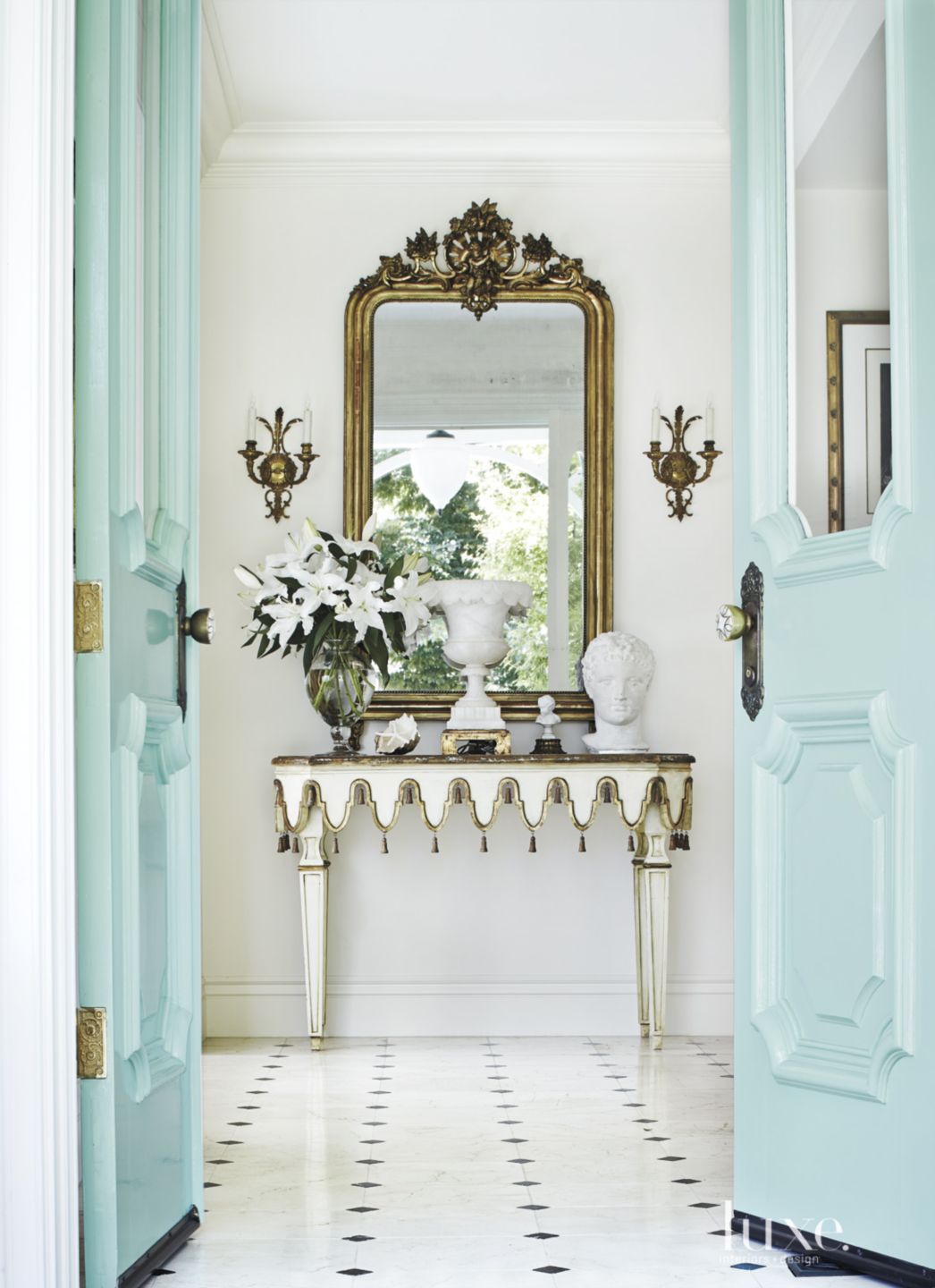 open teal doors in an entry way