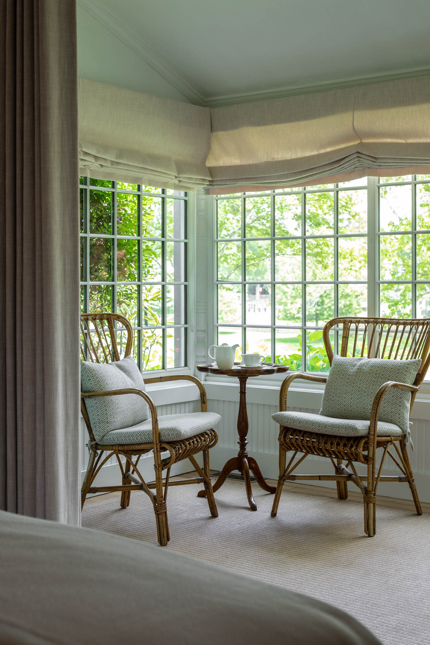 seating area in a sun room portion of a hotel's primary suite