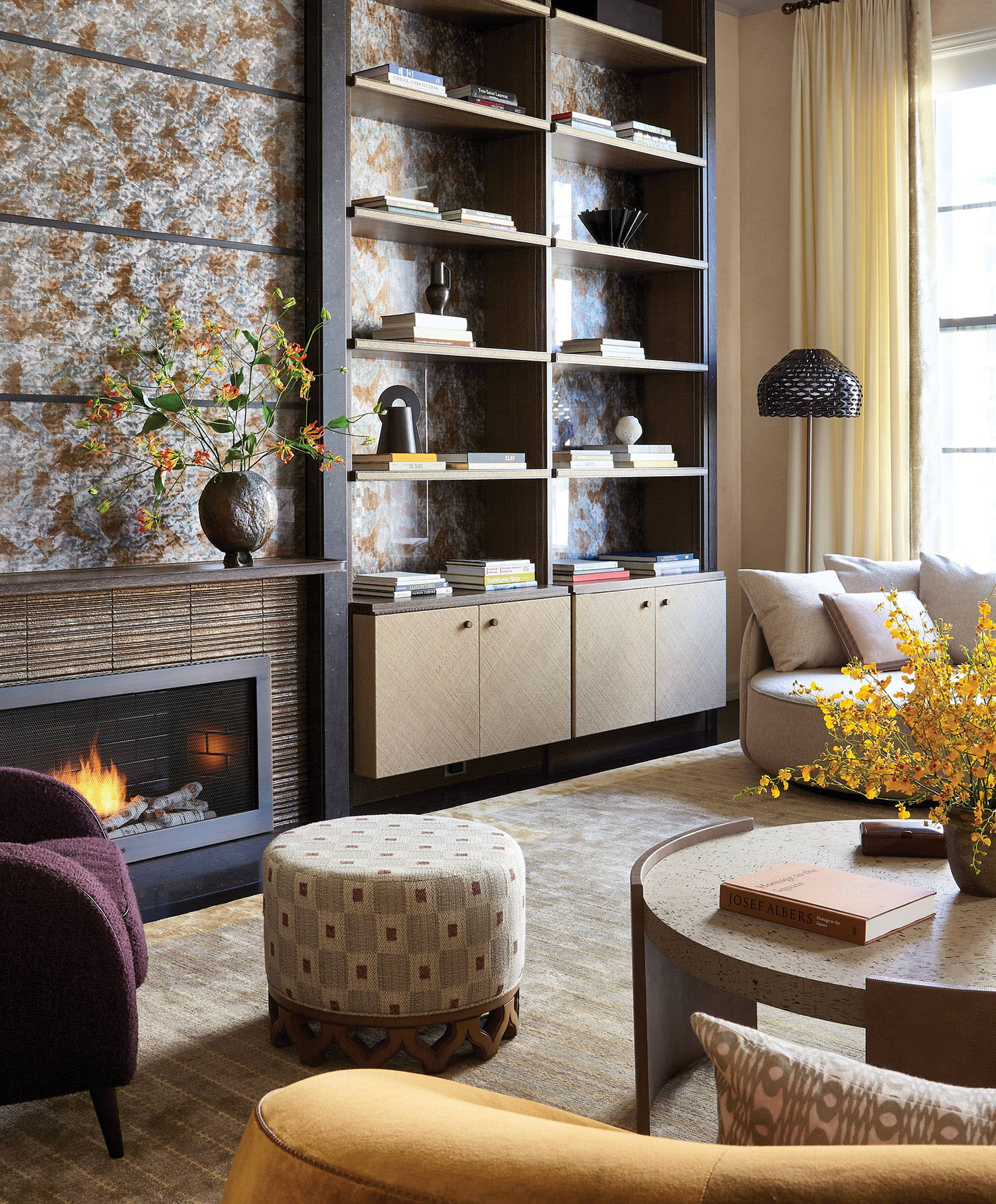 rich living room with a mix of patterns and a moody sensibility