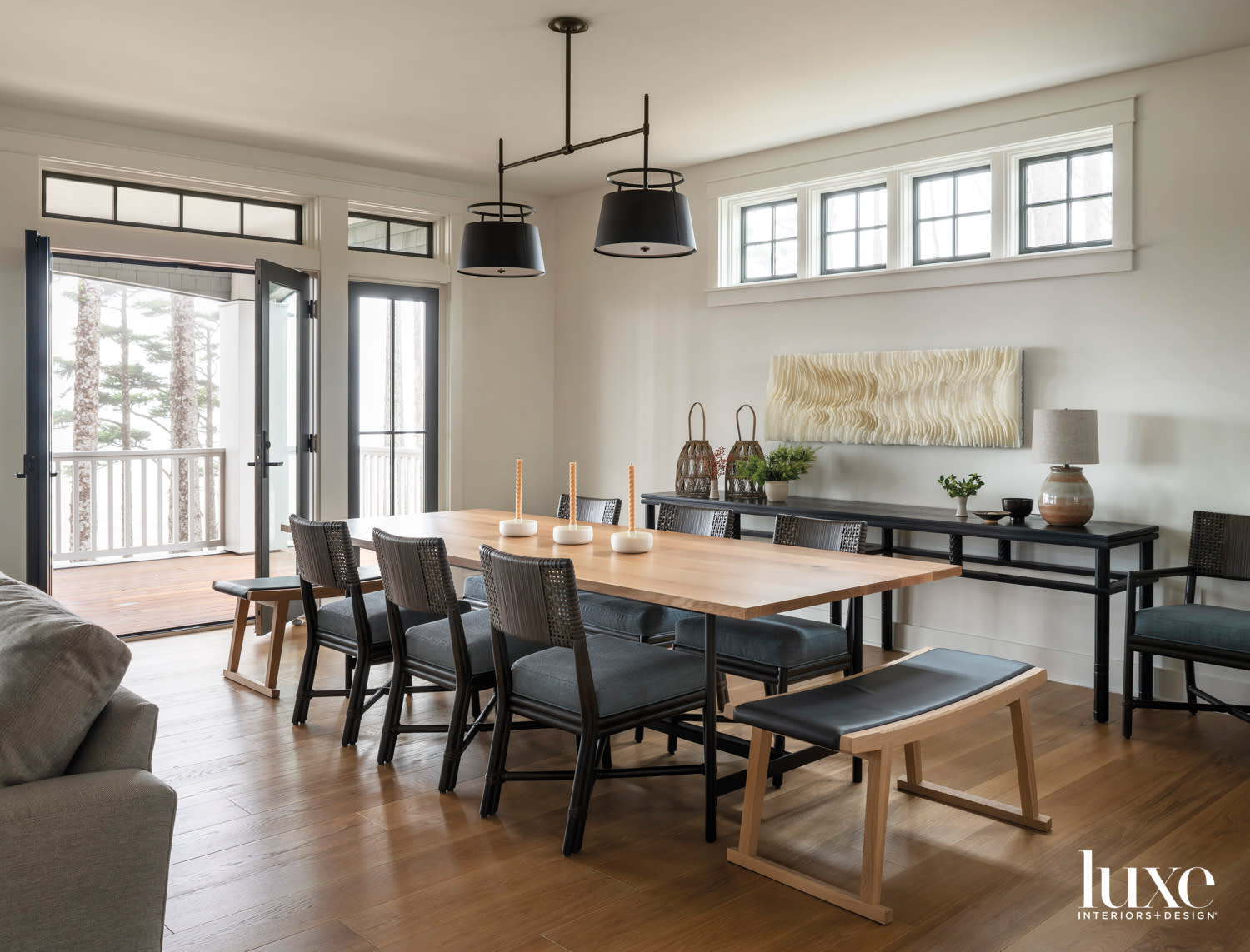 modern dining room with light wood table and balcony opening