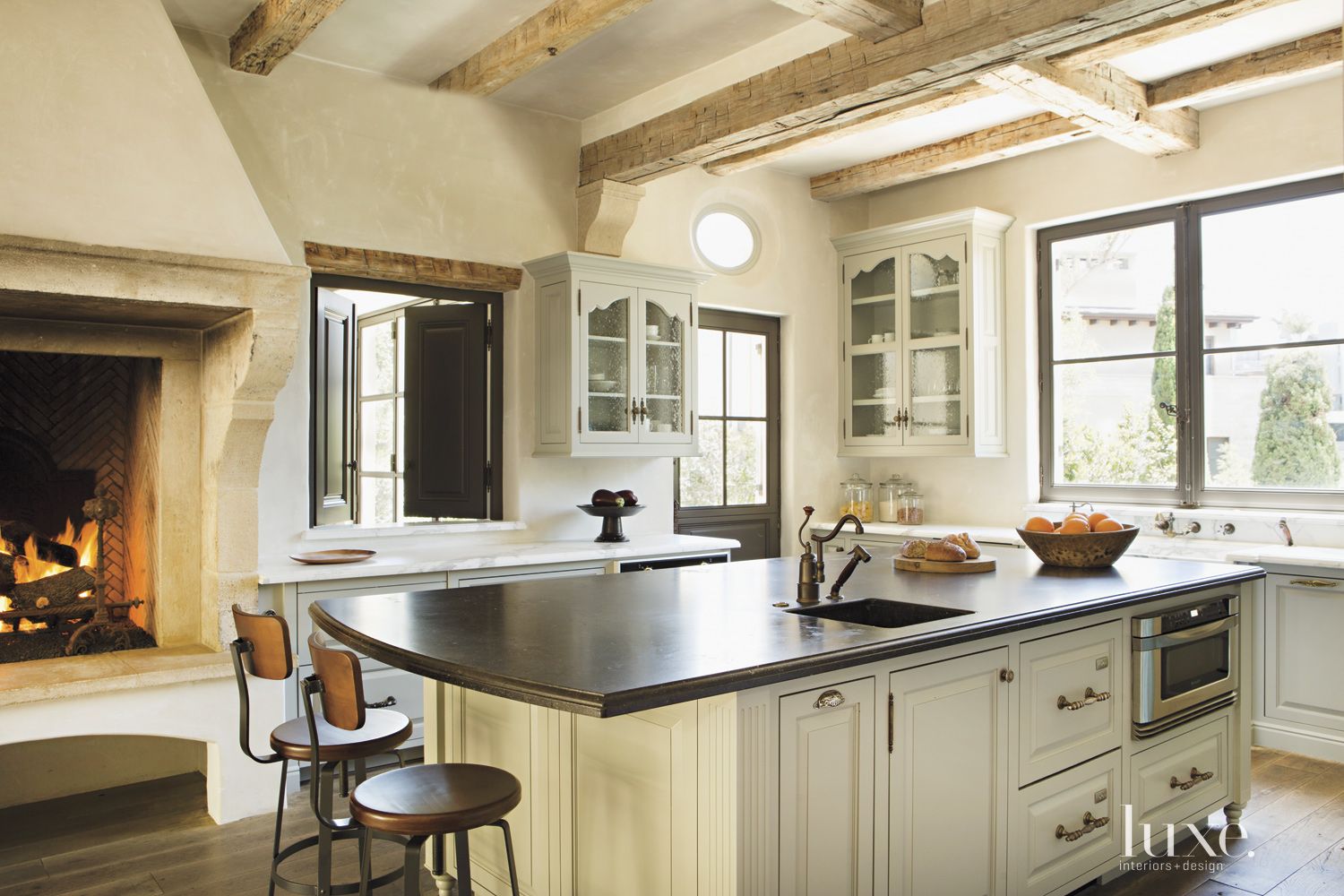 Contemporary Cream Kitchen Fireplace | LUXE Interiors + Design, image size:1500x1000