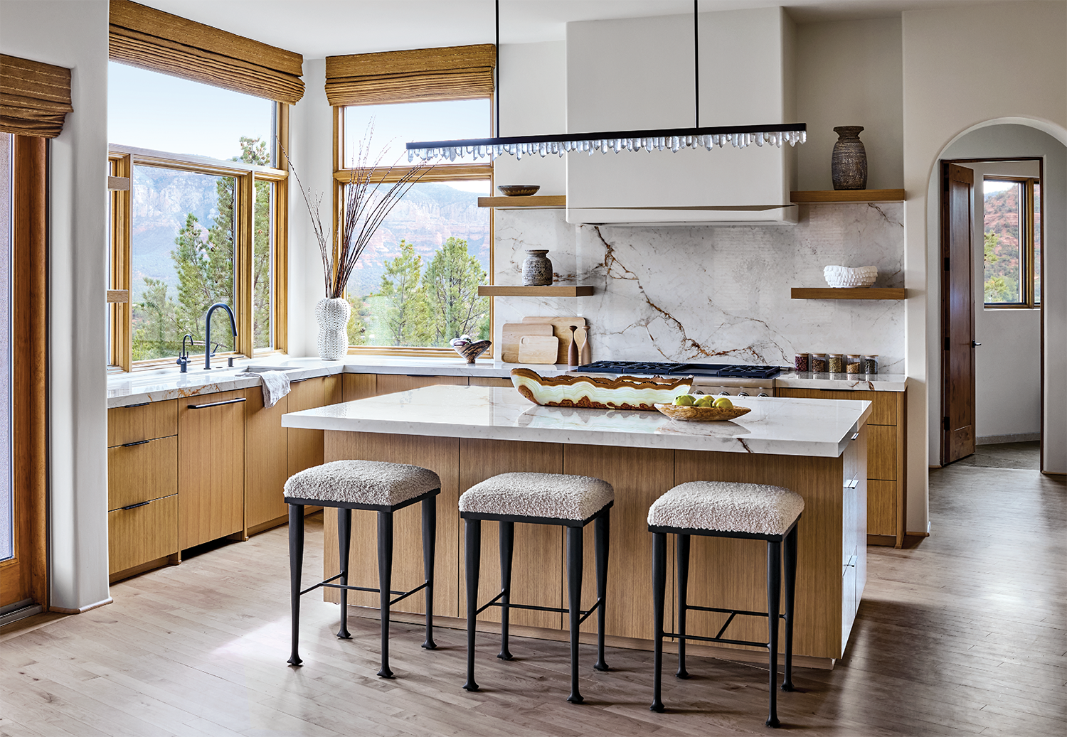 contemporary kitchen with white porcelain countertops and wood accents