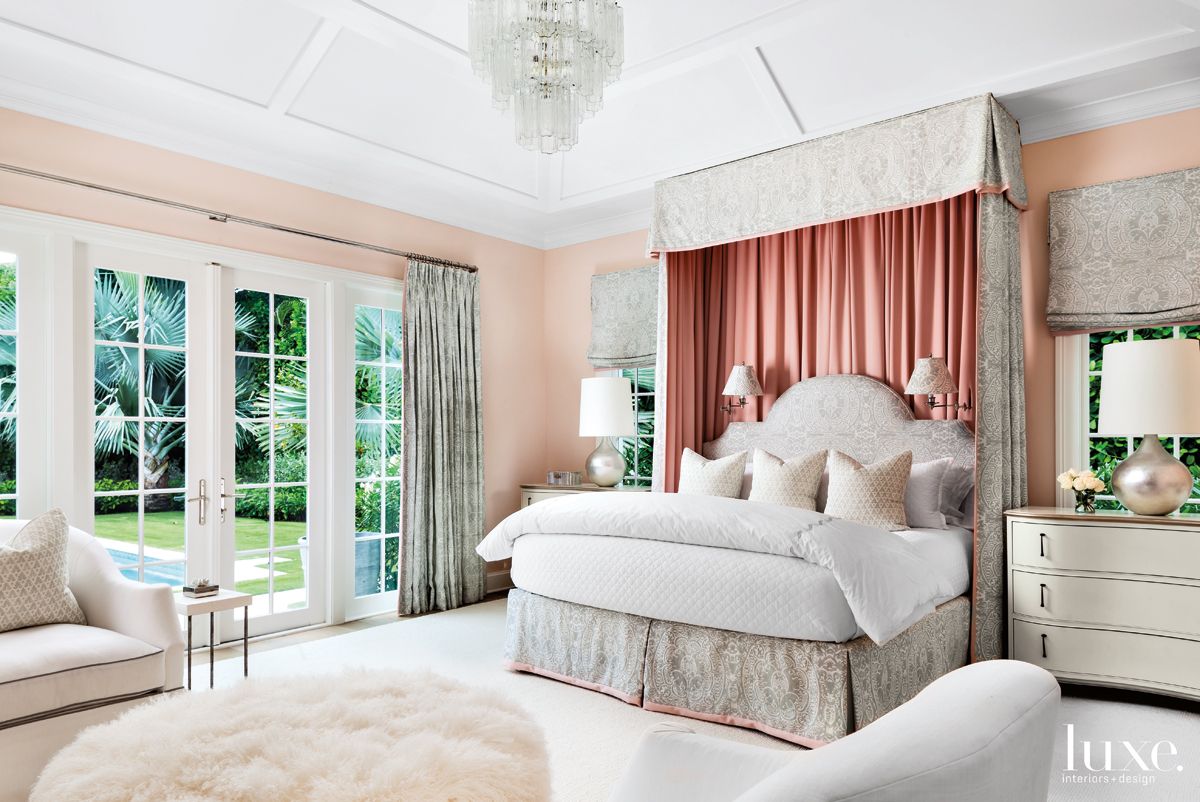 bedroom with red drapes and pink walls