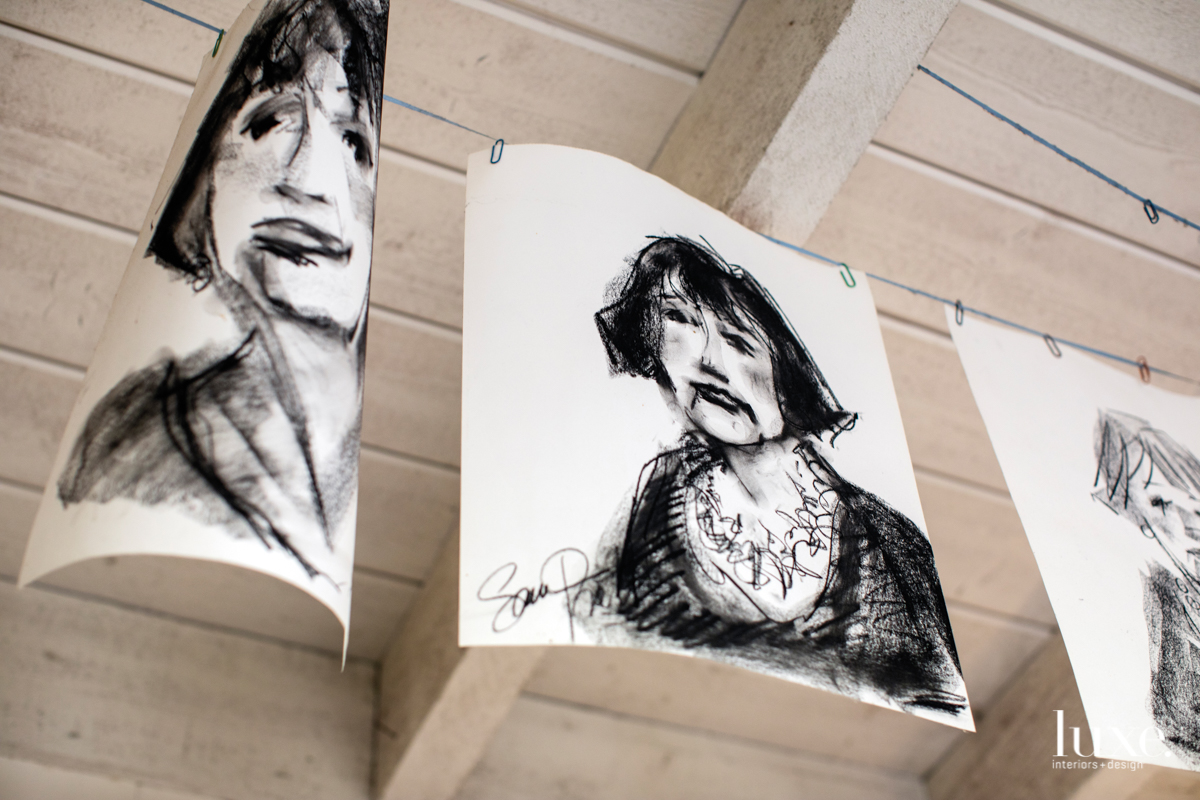 Charcoal portraits by Pratt show Geny Dignac, a local light and fire artist.