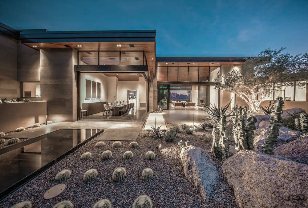 Home that has indoor outdoor living. Rock garden with succulents