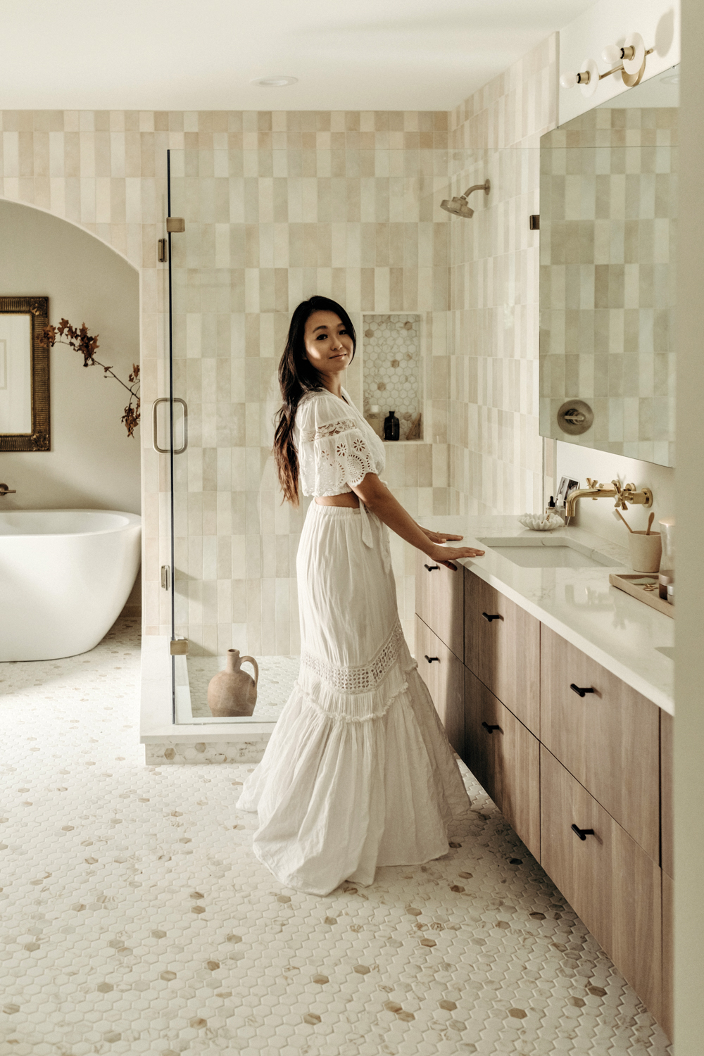 Rowena Lei standing in front of bathroom sink