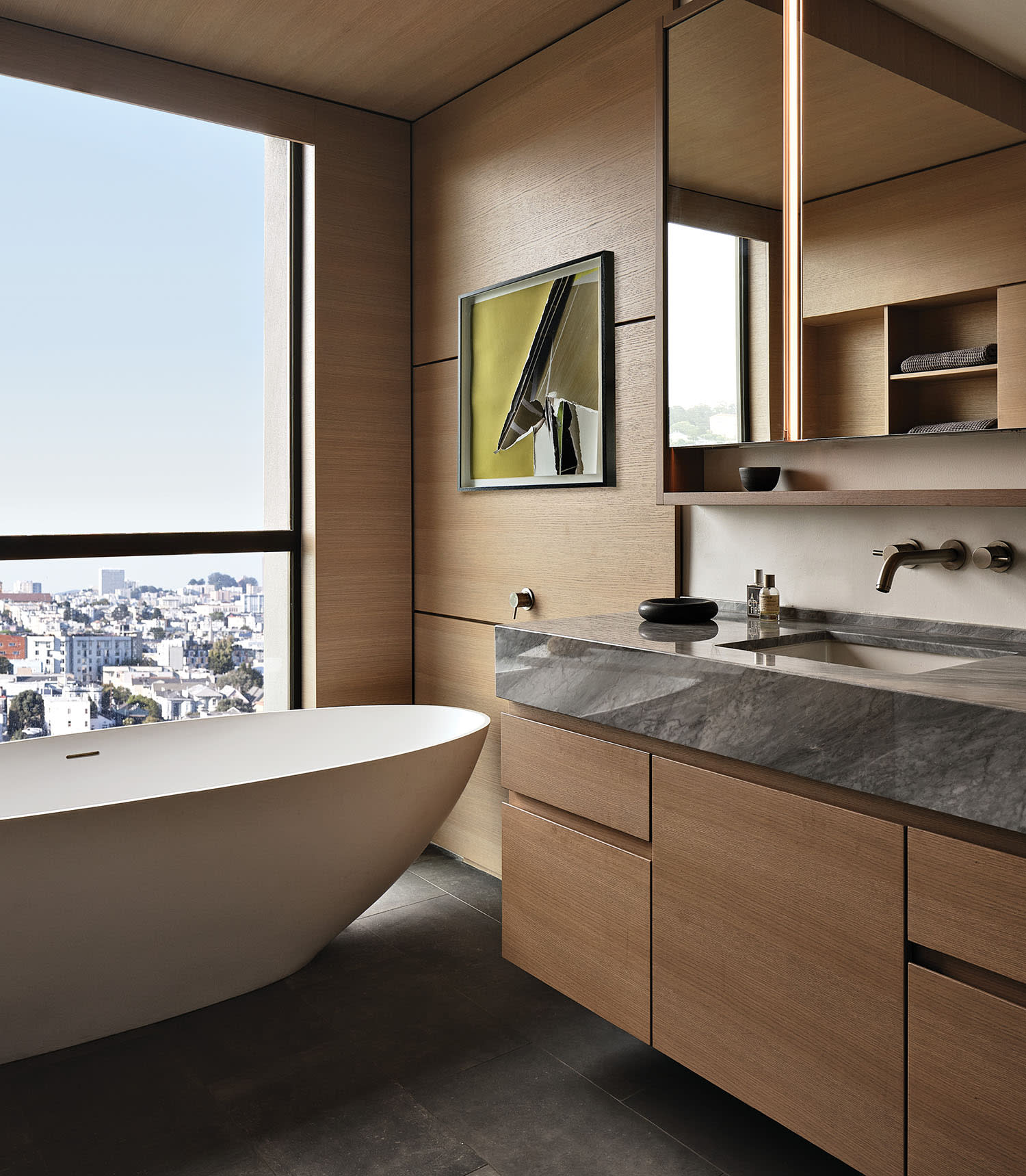 contemporary bathroom with a tub in the window featuring San Francisco city views