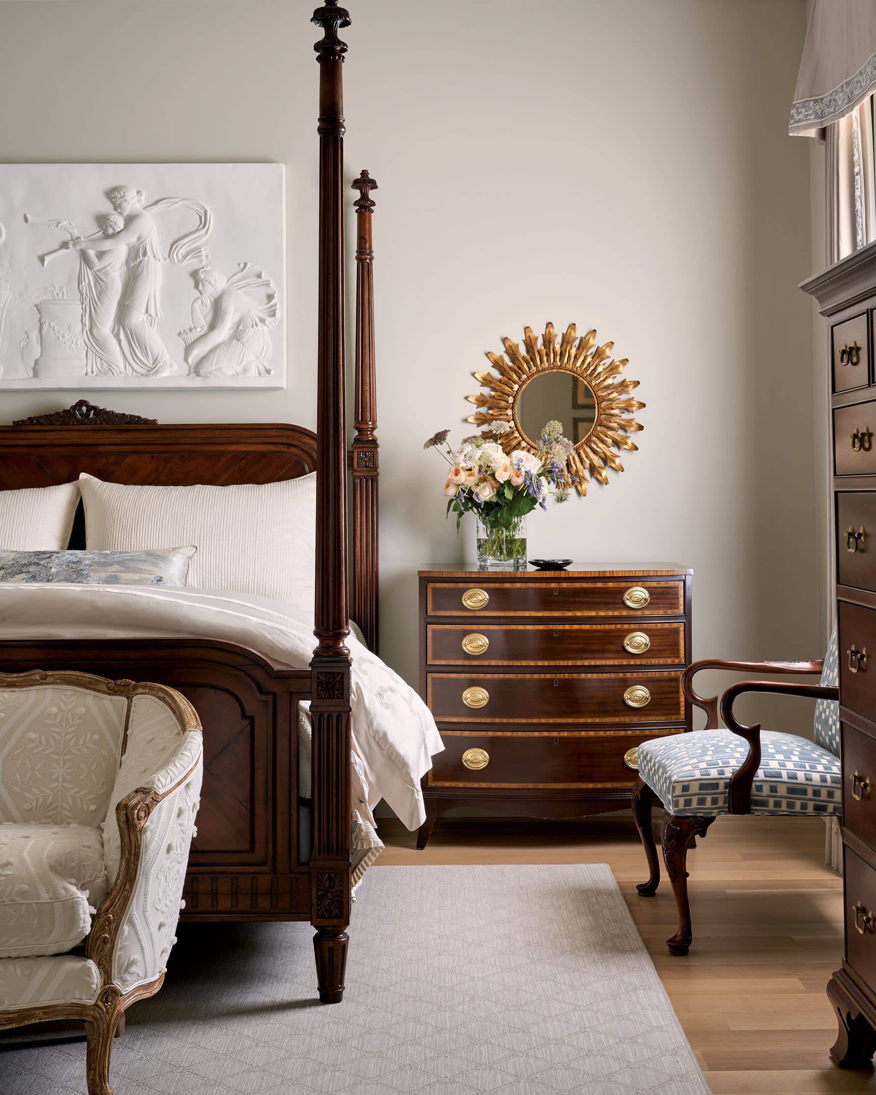 antiques and contemporary furnishes mix in this cozy bedroom