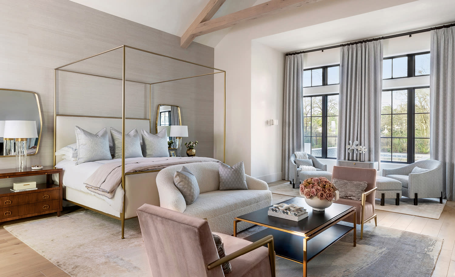 modern, neutral bedroom with a canopy bed 