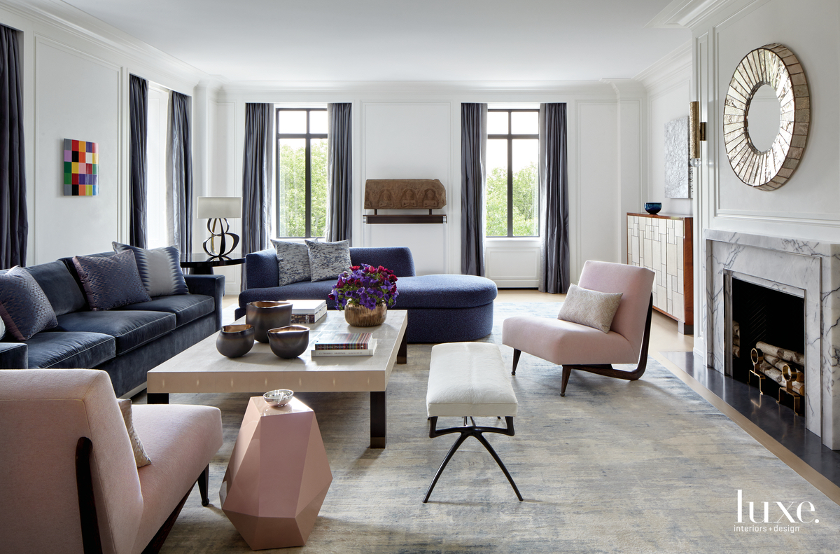 contemporary living room pink chairs fireplace