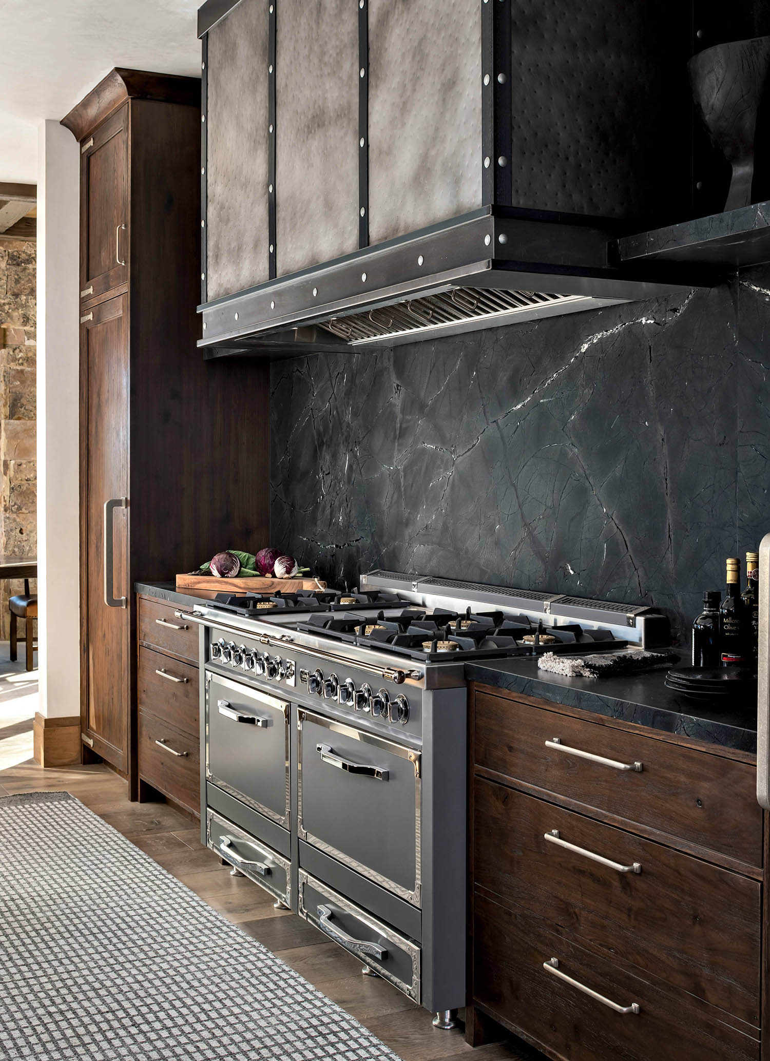 kitchen with black granite countertops and backsplash