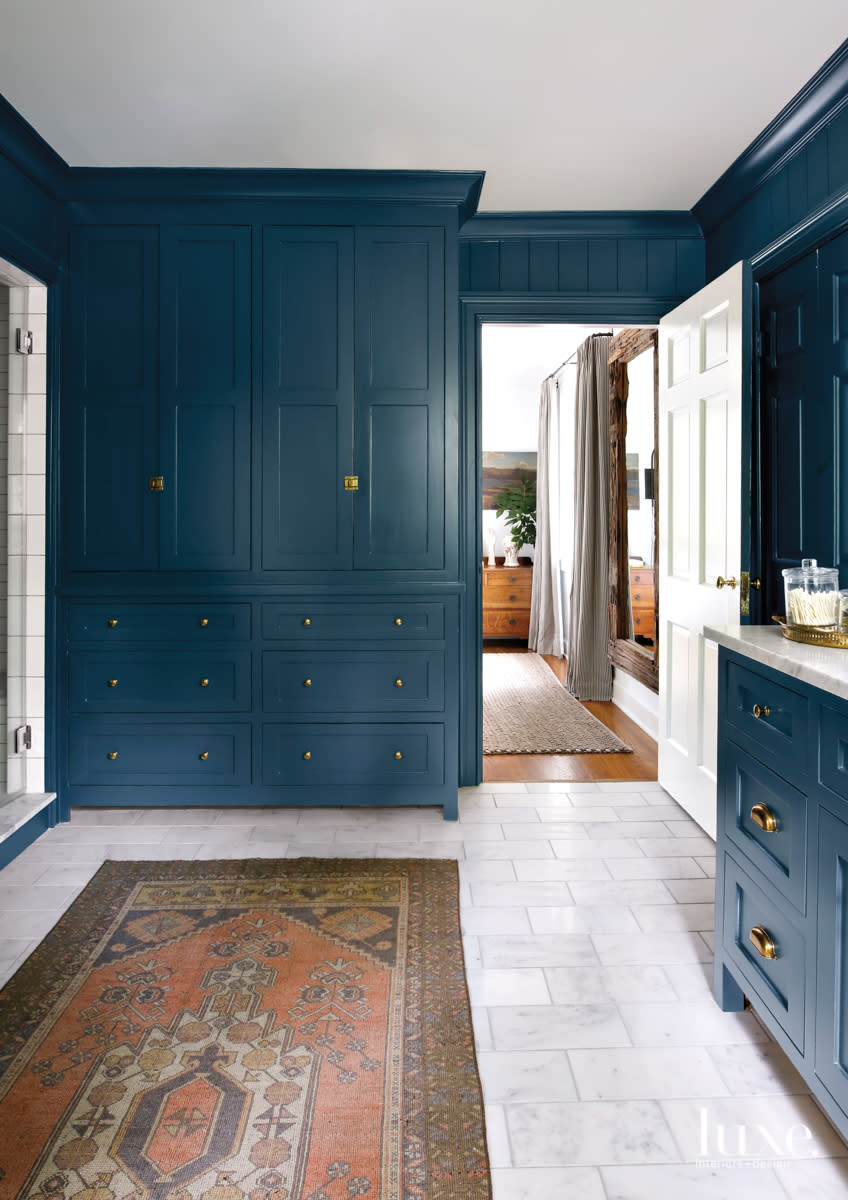 master bathroom cabinetry with honed carrara marble
