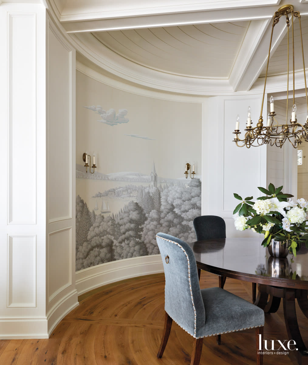 A handpainted Degournay mural covers the wall of the circular dining room.