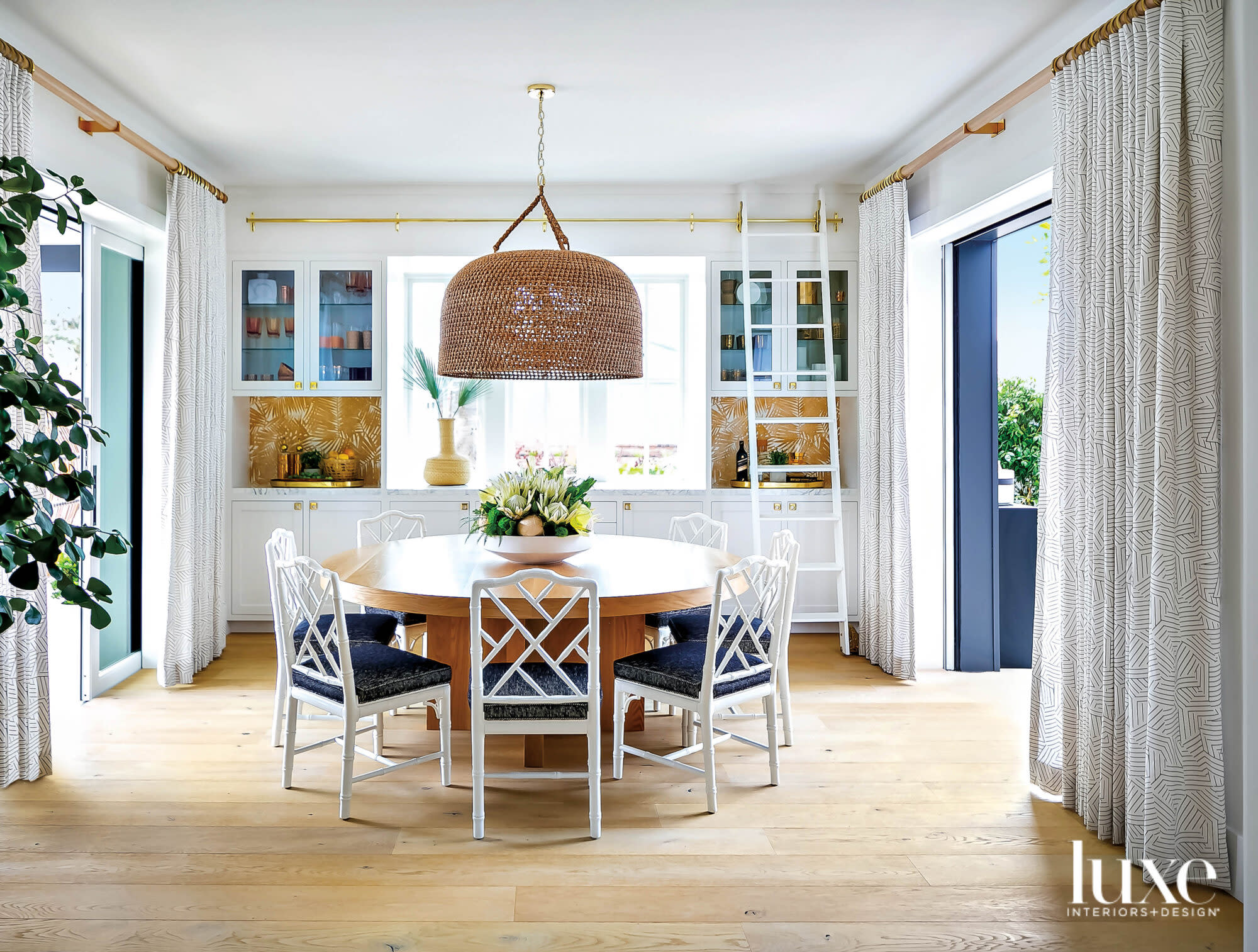 Dining area with round table and faux bamboo chairs