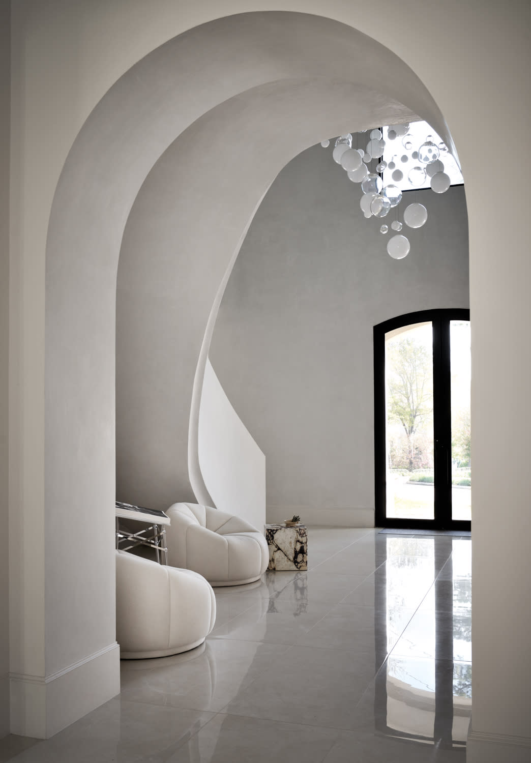 entryway with an arched, dramatic ceiling 