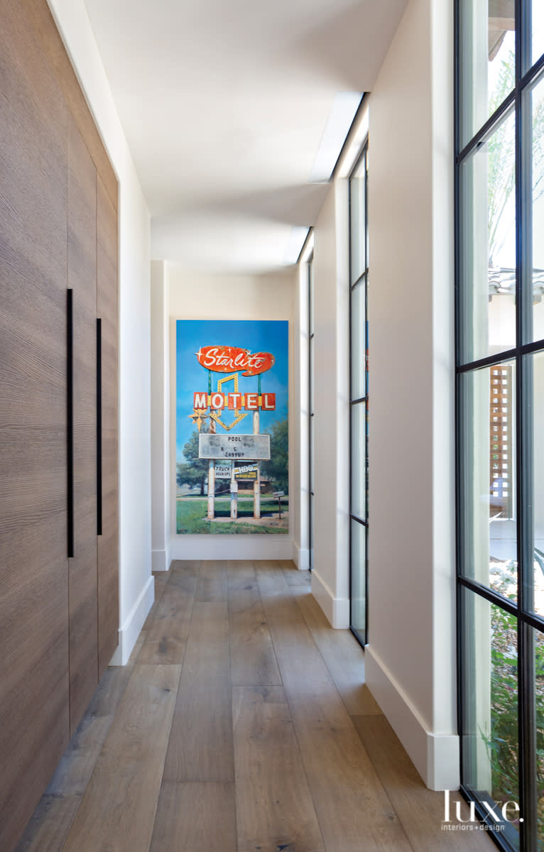 hallway with sleek cabinetry Jason Kowalski painting