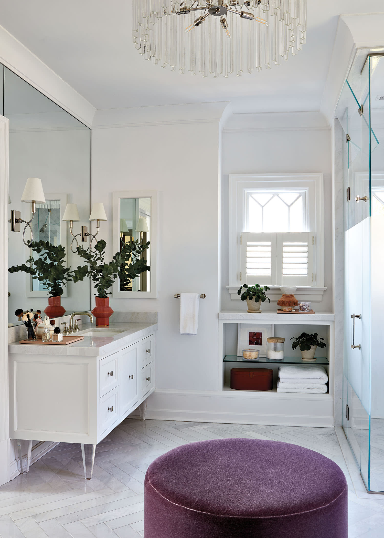 contemporary clean bathroom with a purple ottoman