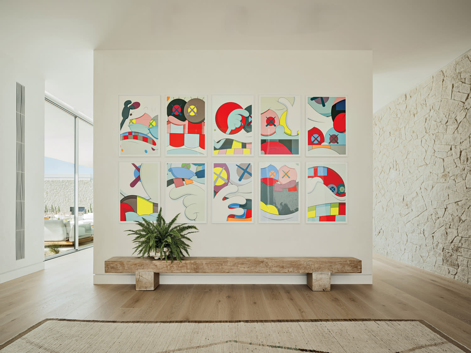 modern foyer with colorful artwork above a bench