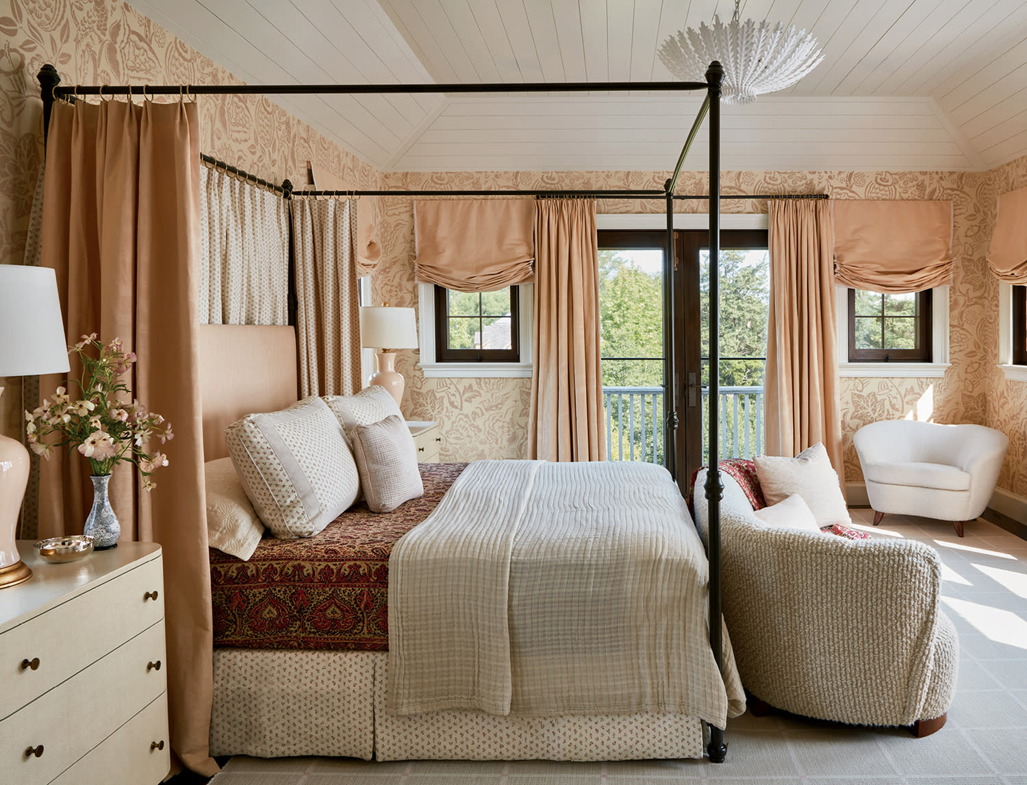 orange and ivory little girl's bedroom with a poster bed with orange curtains