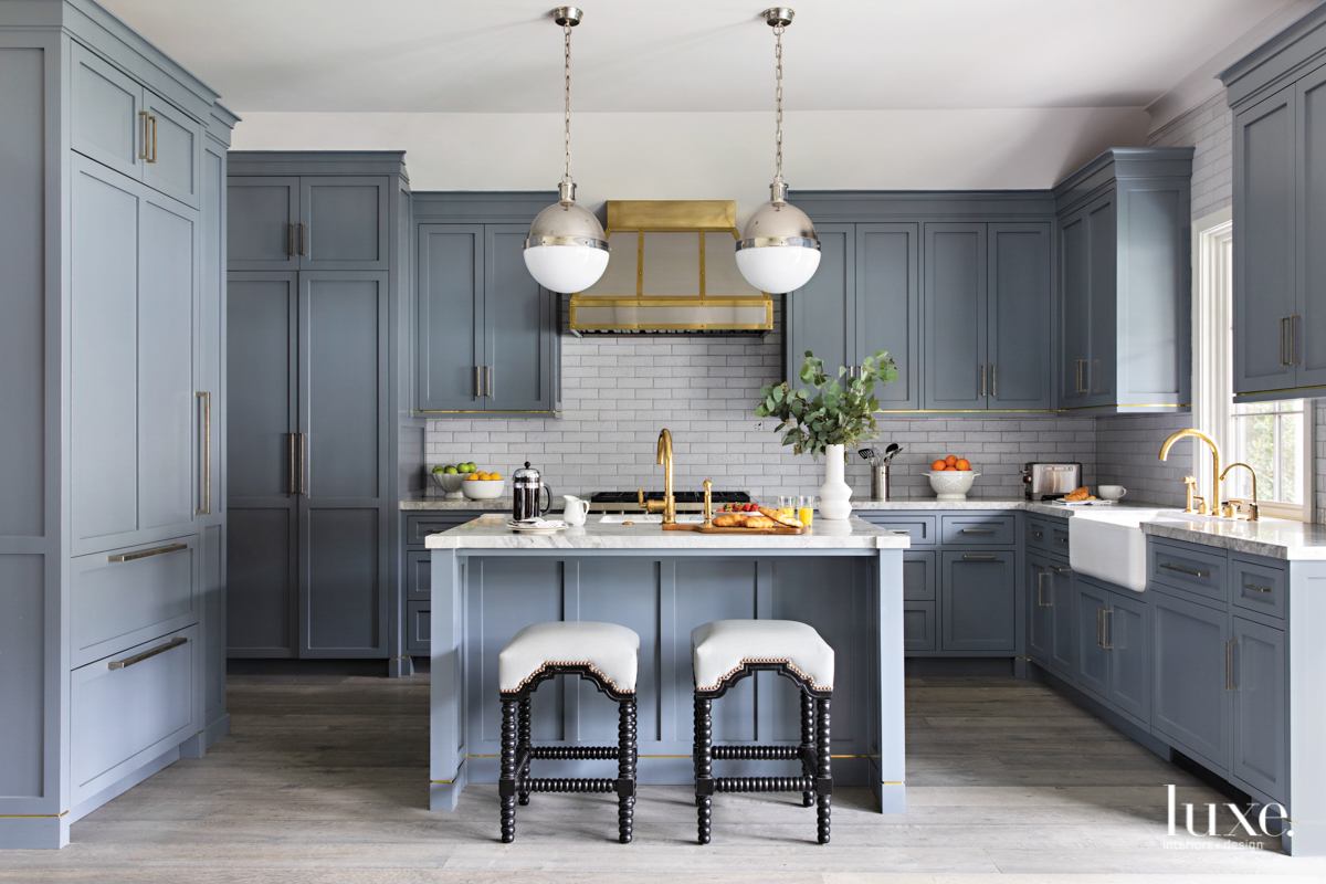 wolf gray kitchen cabinets and brass accents