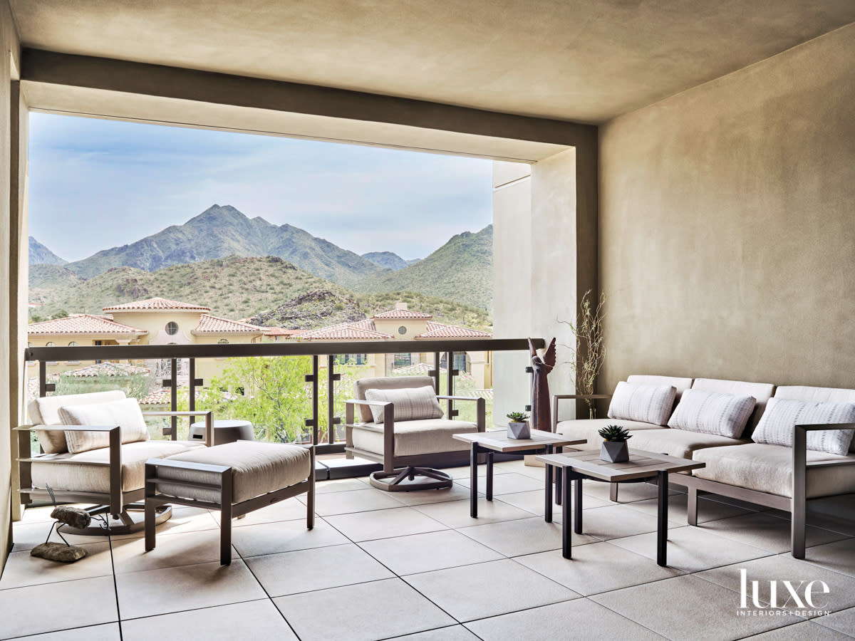 A patio that looks out on mountains.