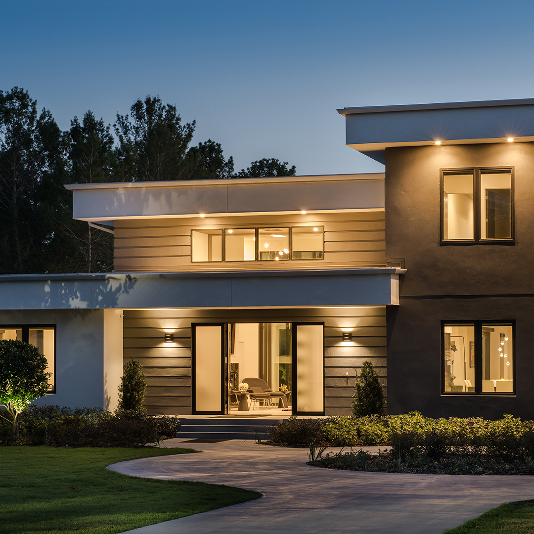 exterior of a home lit up at night