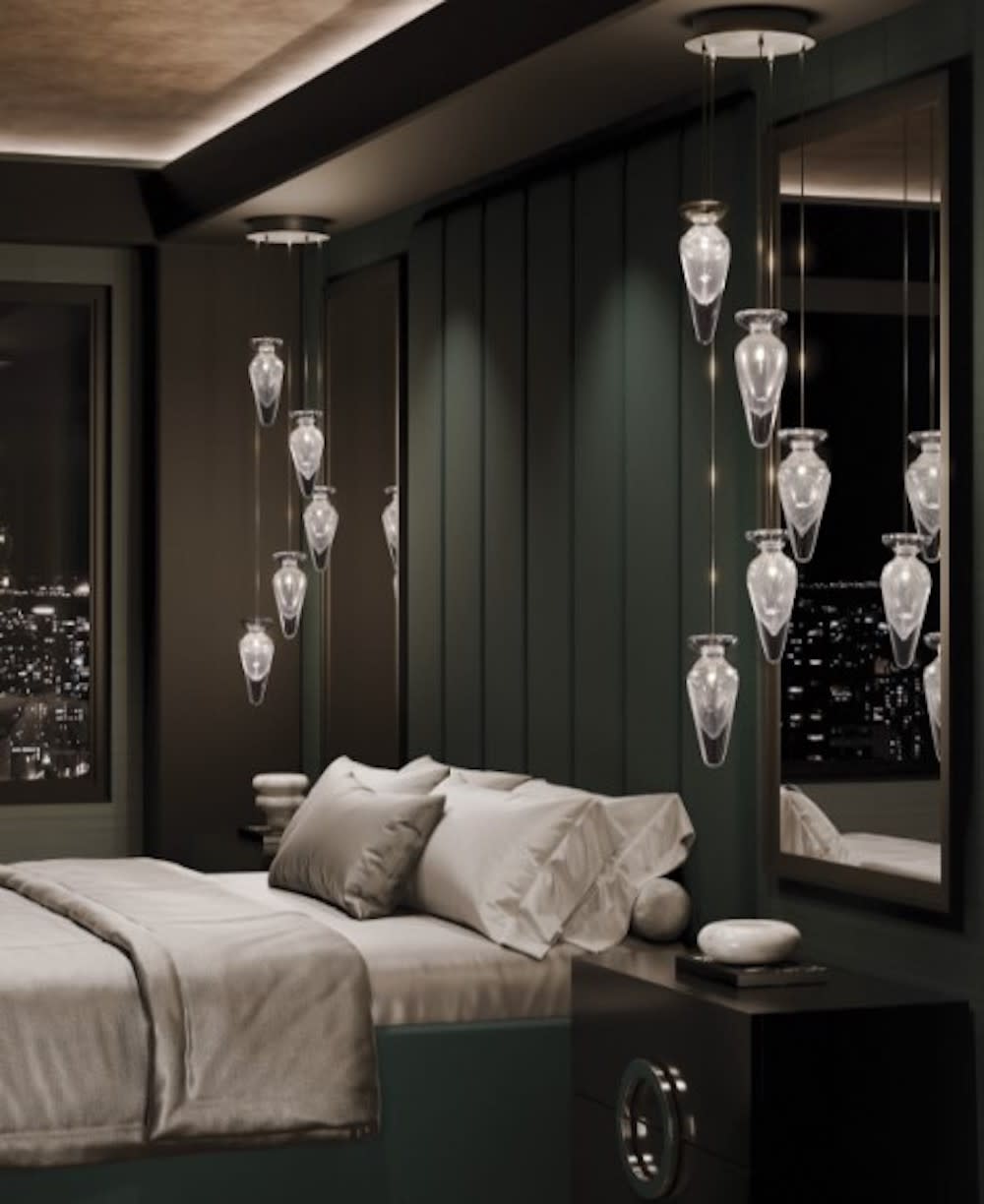 A stylish bedroom with a city view, dark paneling, a lit tray ceiling, and decorative pendant lights on either side of bed.