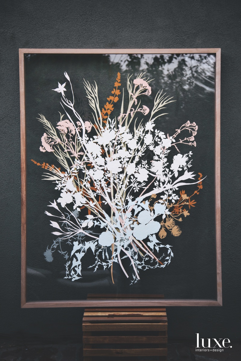 One of Justina's cut-paper works features California native plants including Apache plume, Brodiaea and California wild rose.