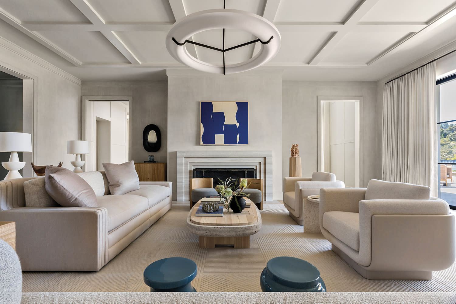 contemporary living room with abstract blue and white artwork