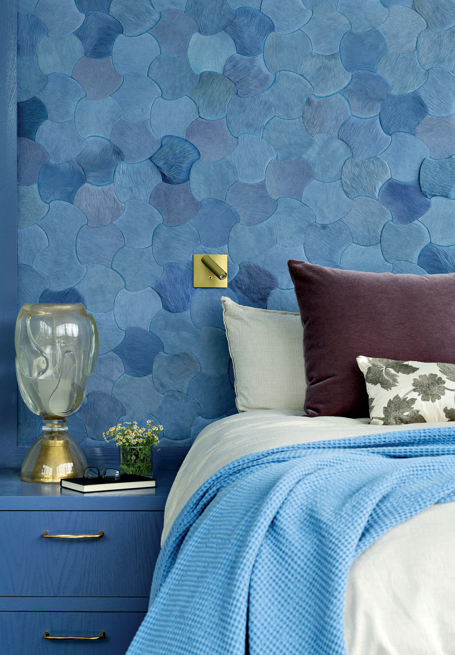 bedroom featuring a blue geometric Kyle Bunting hair-on-hide wallcovering