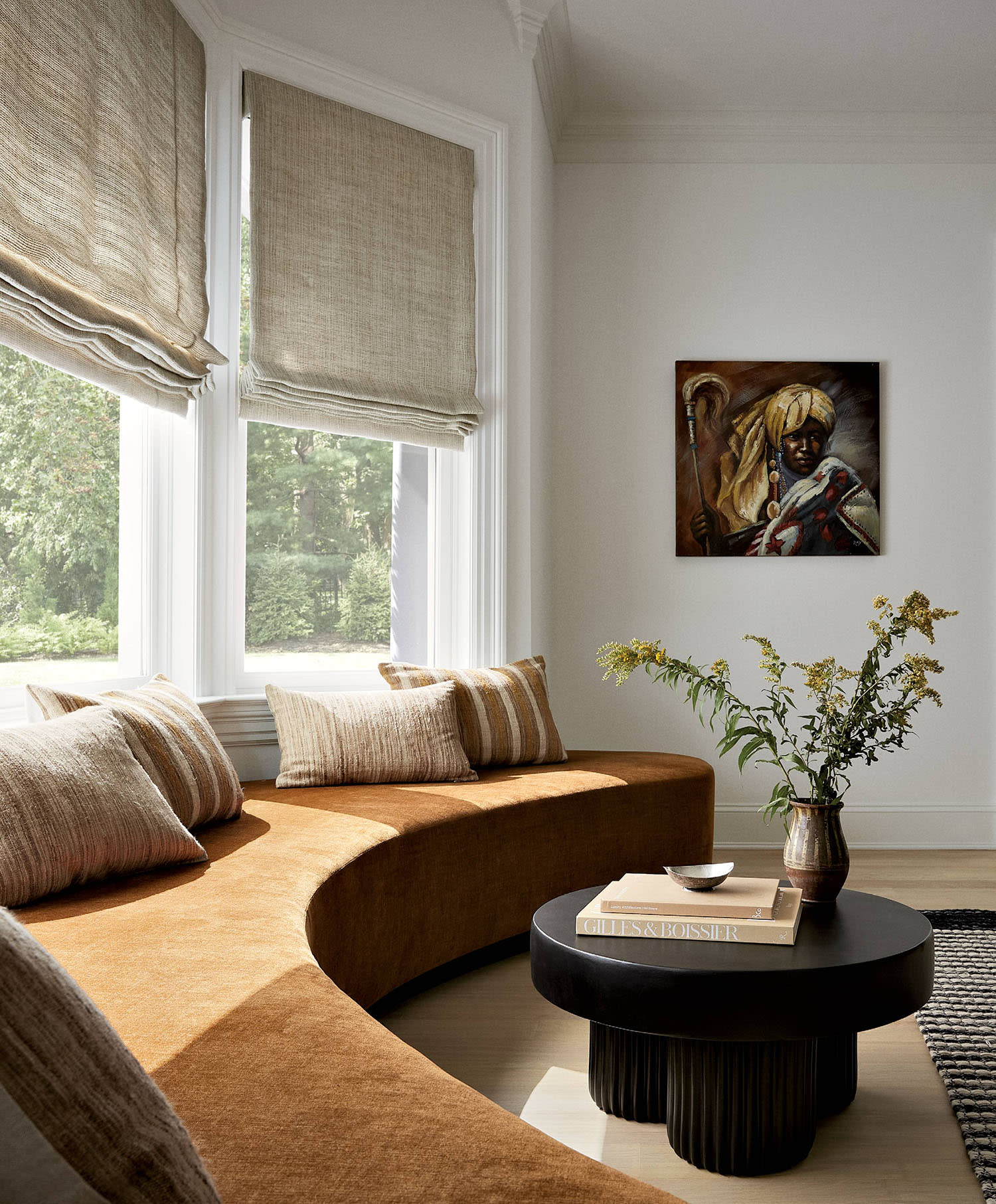 bay window flanked by a curving orange banquette