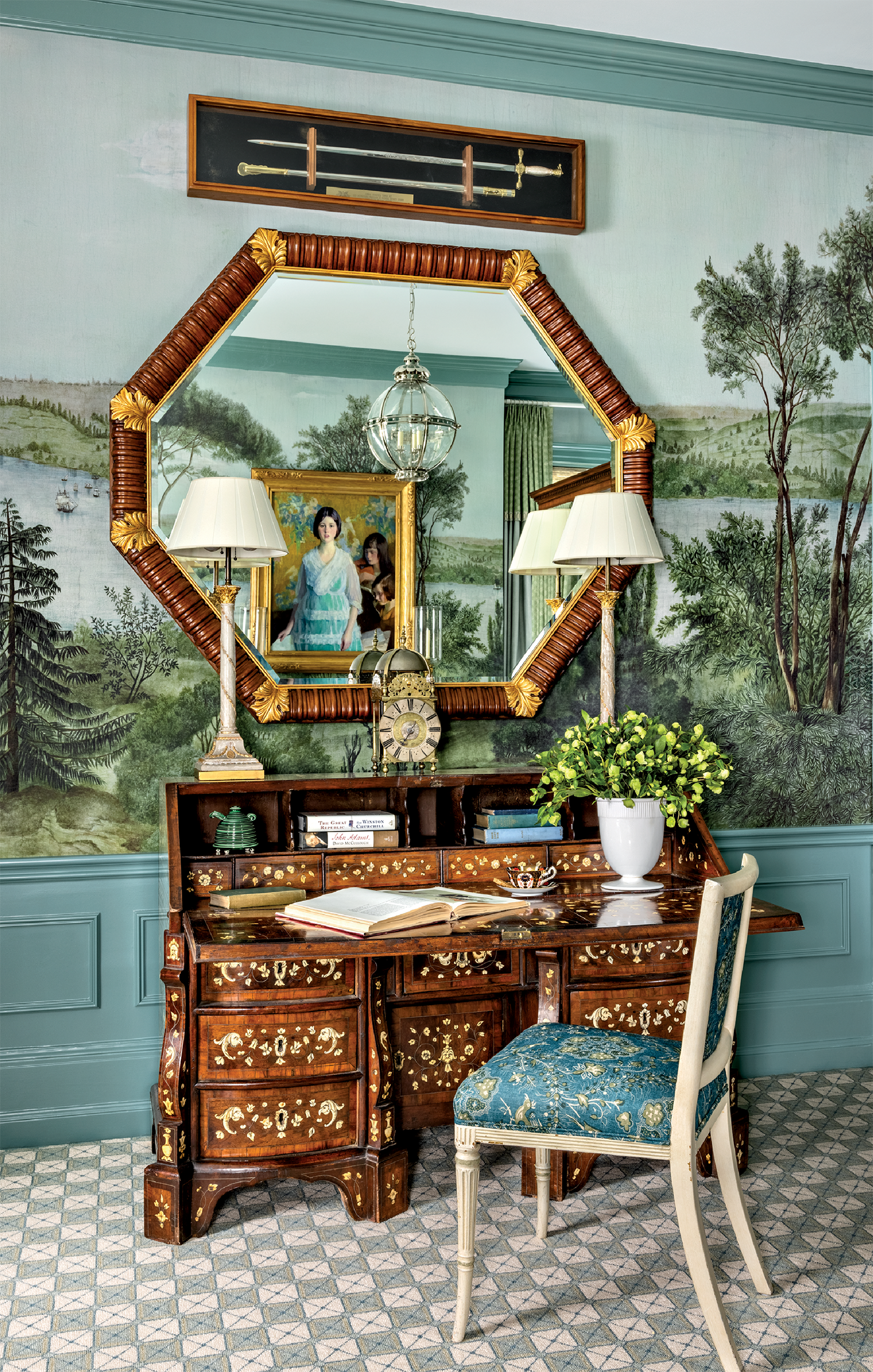 vintage-inspired vanity with a octagonal mirror atop a landscape wall mural